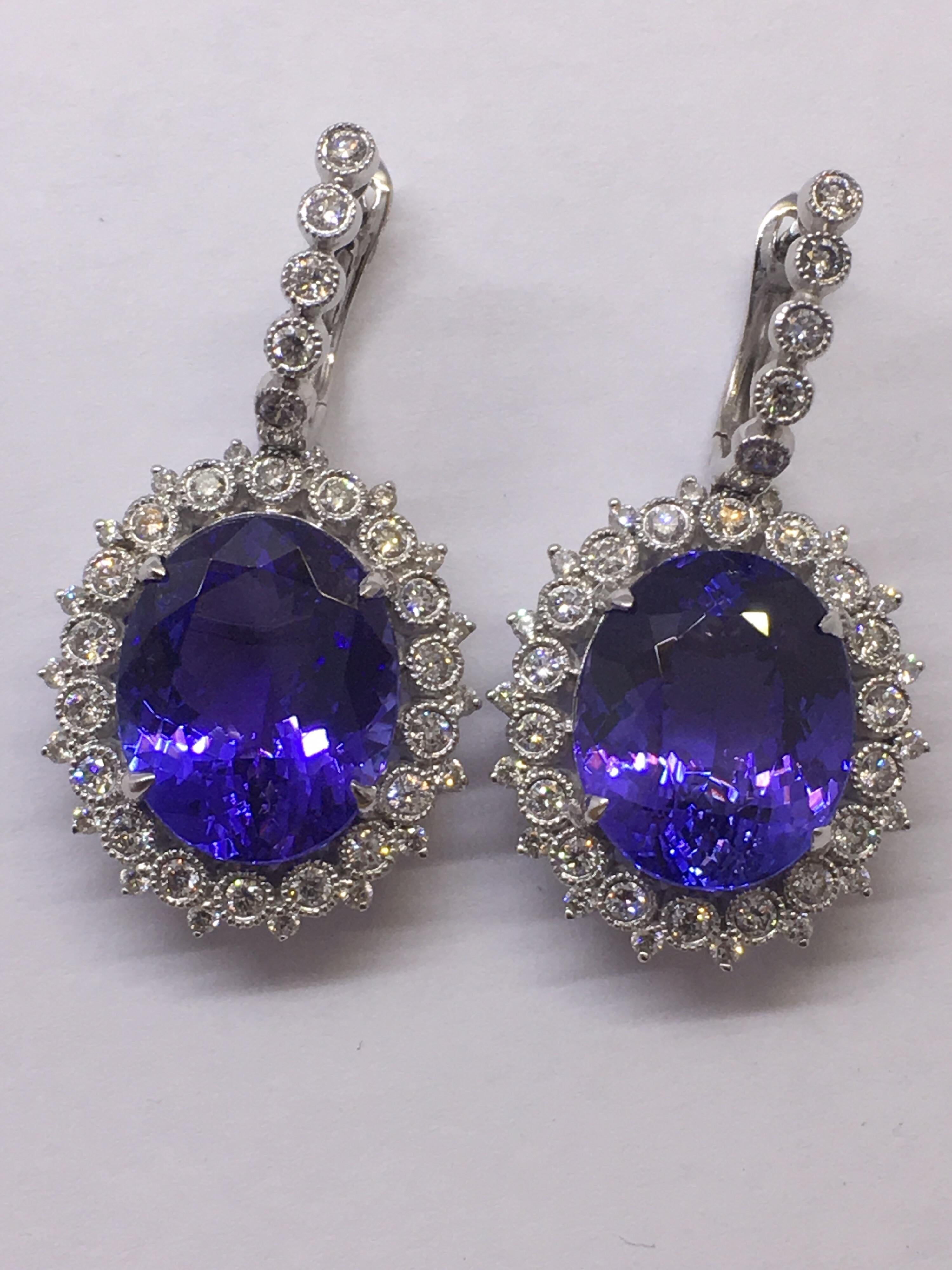 Natural Oval Tanzanite and Diamonds Earrings is set in 14K white Gold.
Total weight of Tanzanite is 16.90 Carat and Total Diamond is 1.18 Carat. The earring is for Pierced ears.
Quality of Tanzanite is AAA Royal Blue with Purple tone.

