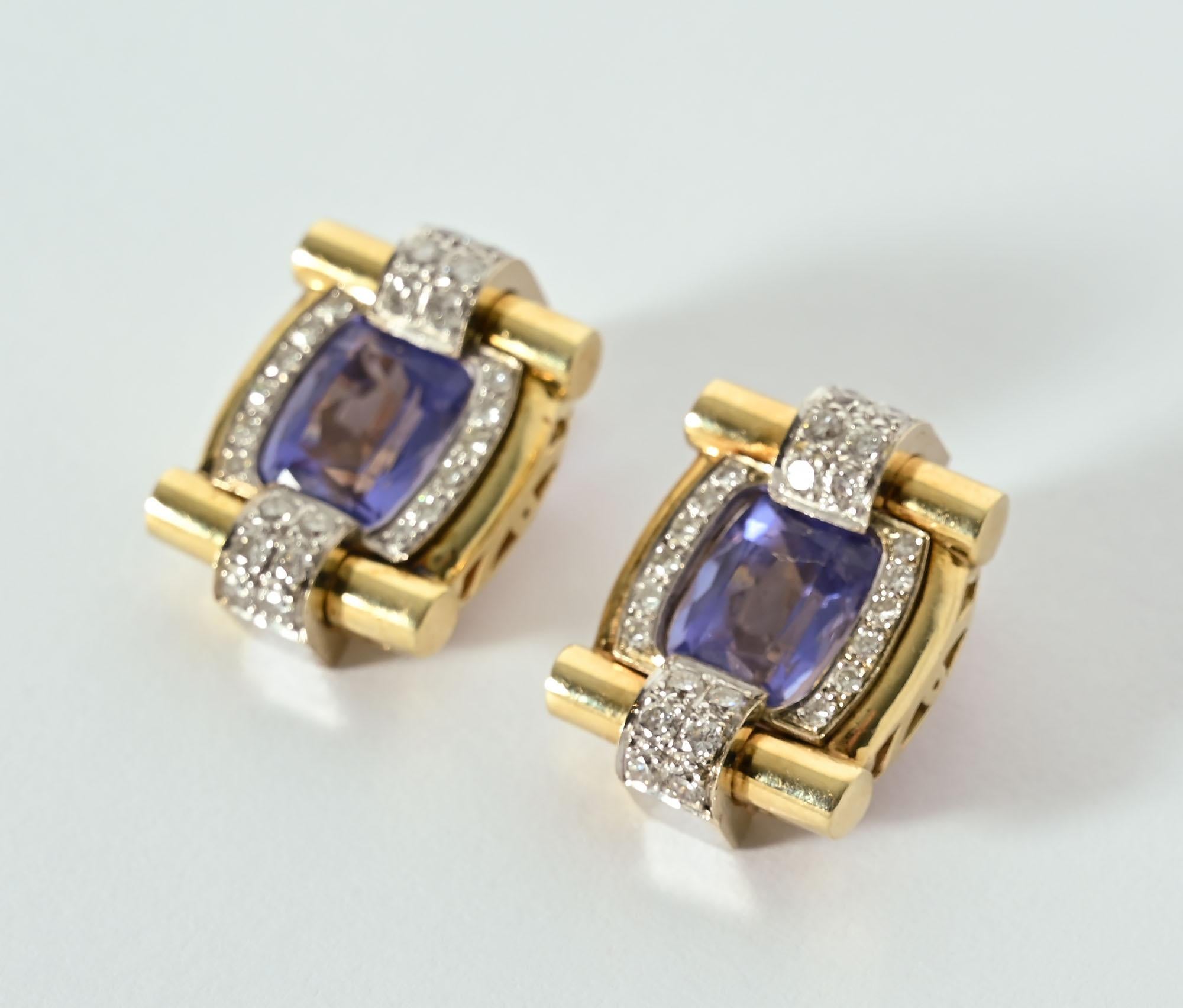 Stylish and unusual tanzanite and diamond clip earrings. Each is centered with a rectangular tanzanite stone with a total weight of 3 carats. Above and below as well as on either side are 48 diamonds with a total weight of approximately .5 carats.