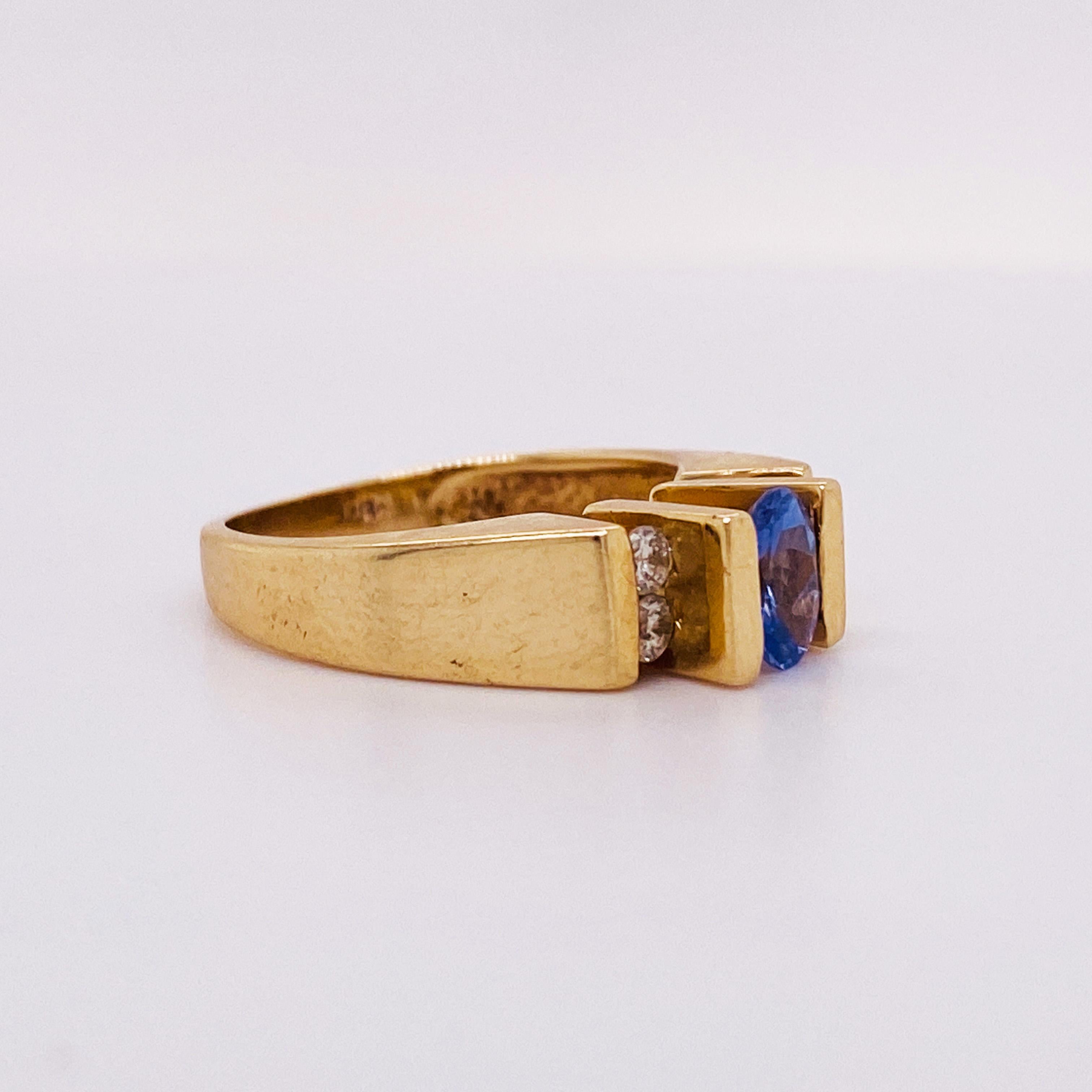 This stunningly beautiful tanzanite ring would make anyone thrilled to receive it! The bright, vibrant purple/blue tanzanite gemstones set in polished 14k yellow gold provide a look that is very modern and classic at the same time! This ring is very