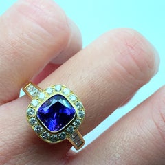Tanzanite and diamond halo cocktail ring 18k yellow gold