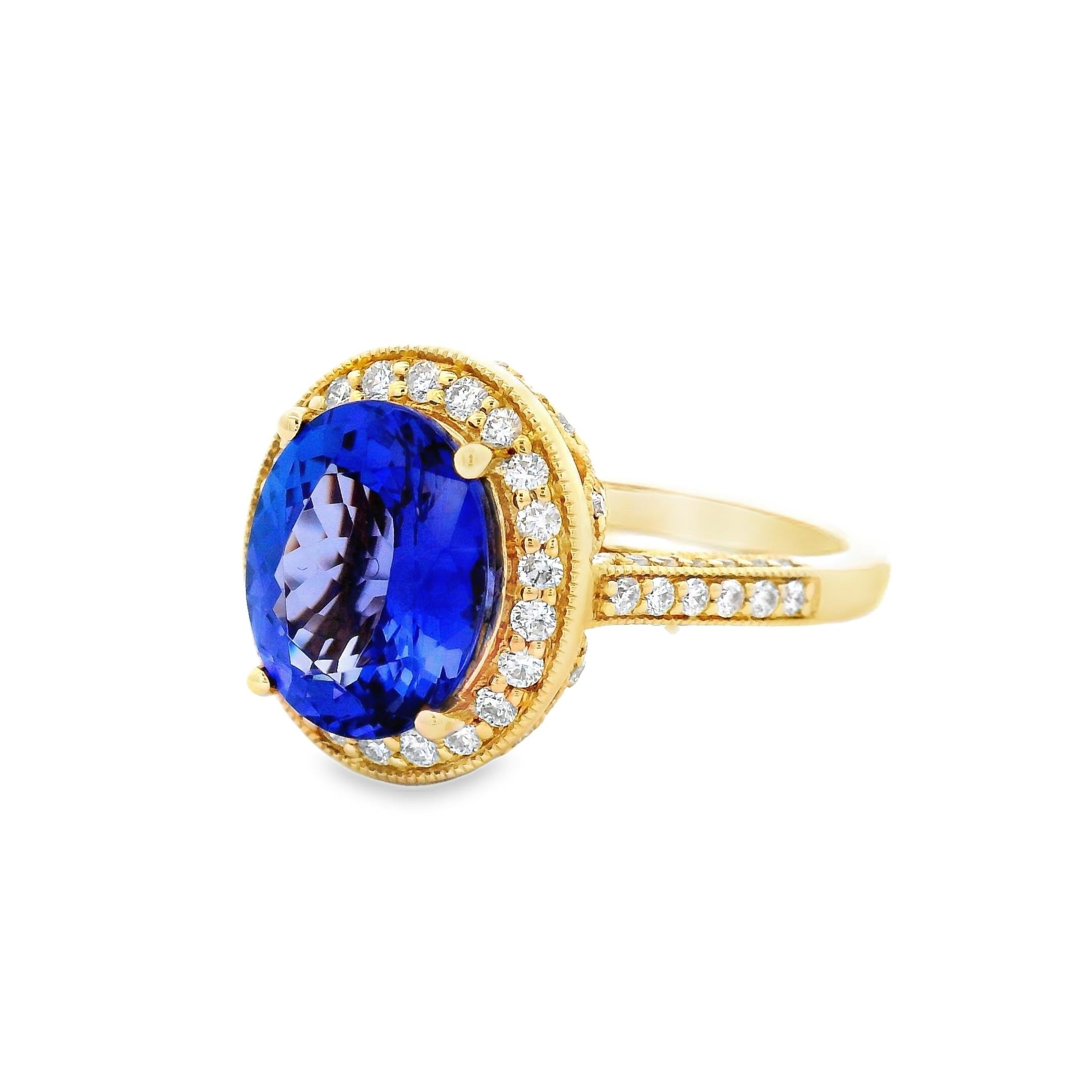 A vivid pop of violet-blue takes center stage in this oval-cut Tanzanite and diamond halo ring. The 2.78-carat center stone is beautifully framed by 82 round diamonds, creating a luminous border and continuing down the shoulders of the ring for