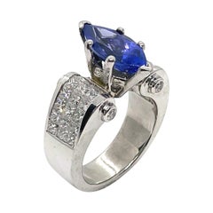 Bague en platine sertie de tanzanite et de diamants de manière invisible, vers 1990