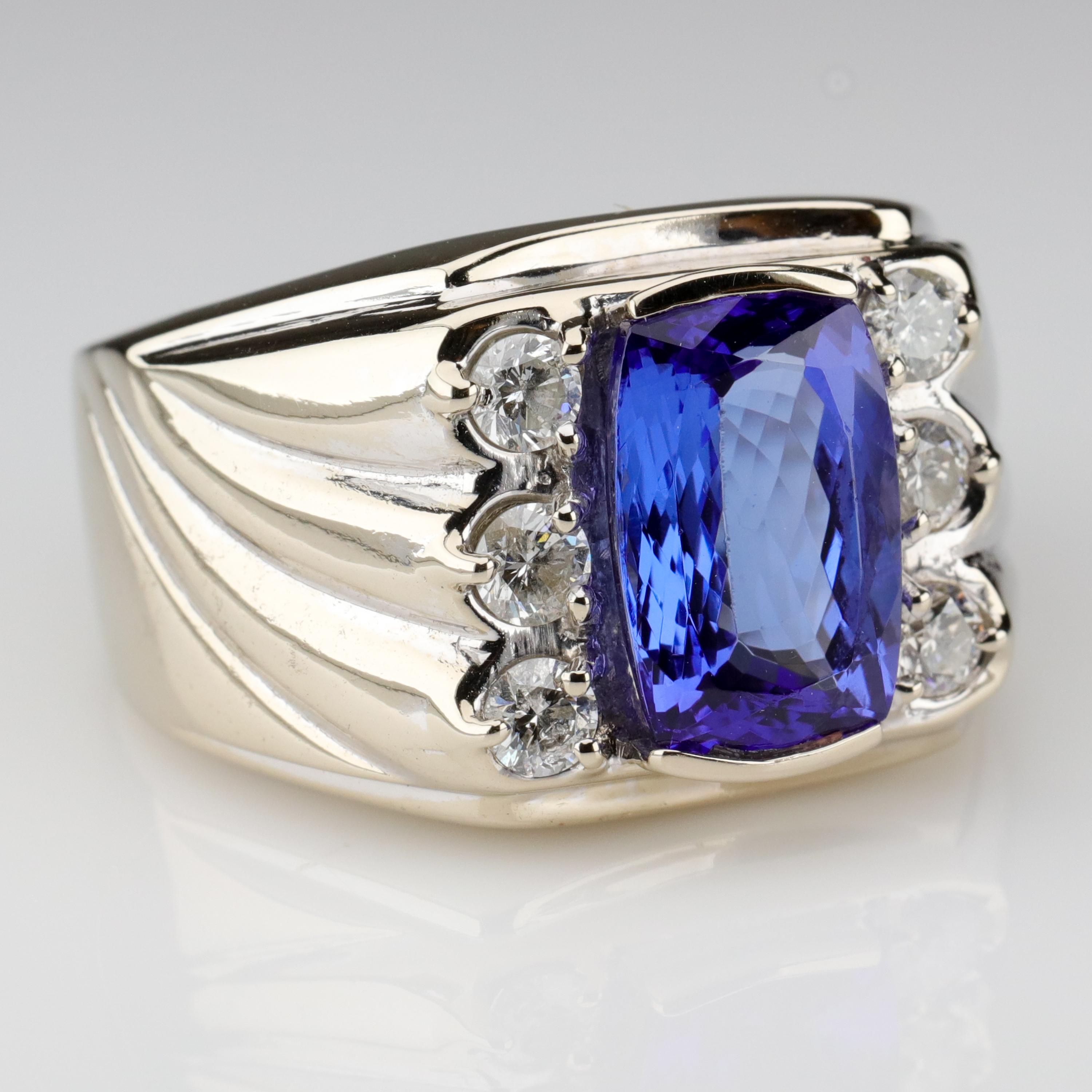 Fatal Attraction, Sony Walkman, Rubik's Cube, Swatch, Willi Wear, The Go-Go's, Erasure, Baby Fae and her baboon heart, MTV, the personal computer, and this massively impressive tanzanite and diamond white gold ring styled in the fashion created by