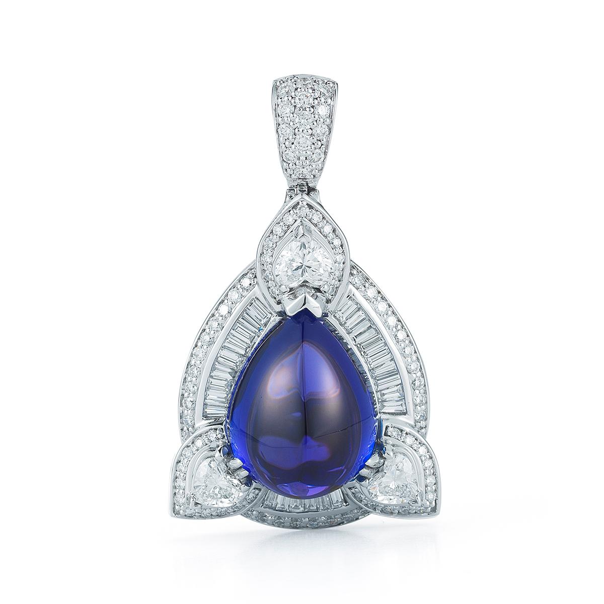 TANZANITE PEAR CABOCHON PENDANT BY RAYAZTAKAT
A celebratory setting fit for this exceptional pear shape Tanzanite. A fabulous look with diamond studs or the matching earrings.
Item:	# 01699
Setting:	18K W
Lab:	C.Dunaigre
Color Weight:	23.05 ct. of