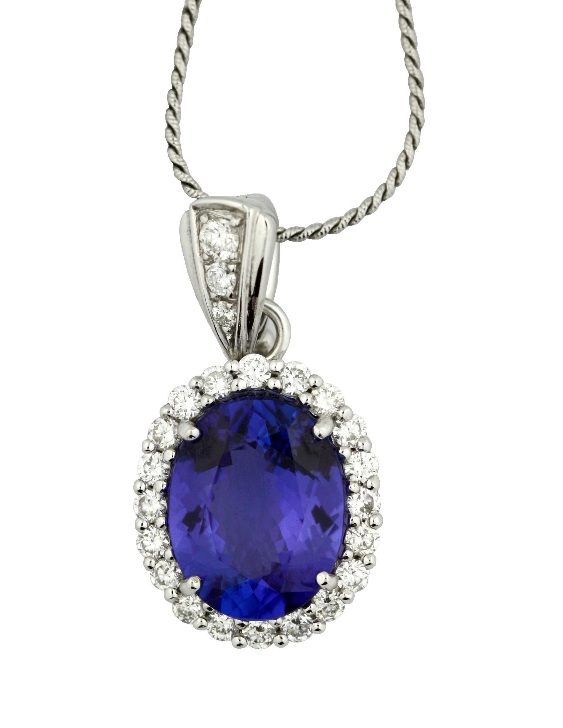 TANZANITE AND DIAMOND PENDANT
The 18 karat white gold pendant set with a oval-shaped tanzanite weighing approximately 4.06 carats, the surmount set with brilliant-cut diamonds, to a fine chain necklace, length approximately 8 inches.