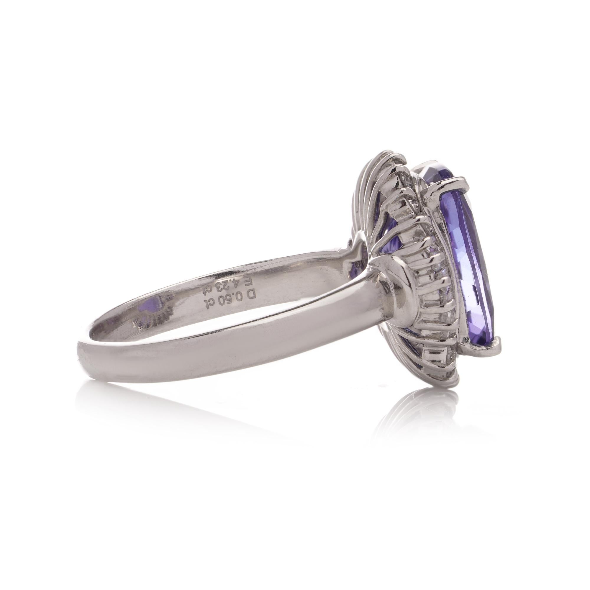 Brilliant Cut Tanzanite and diamond platinum cluster ring For Sale