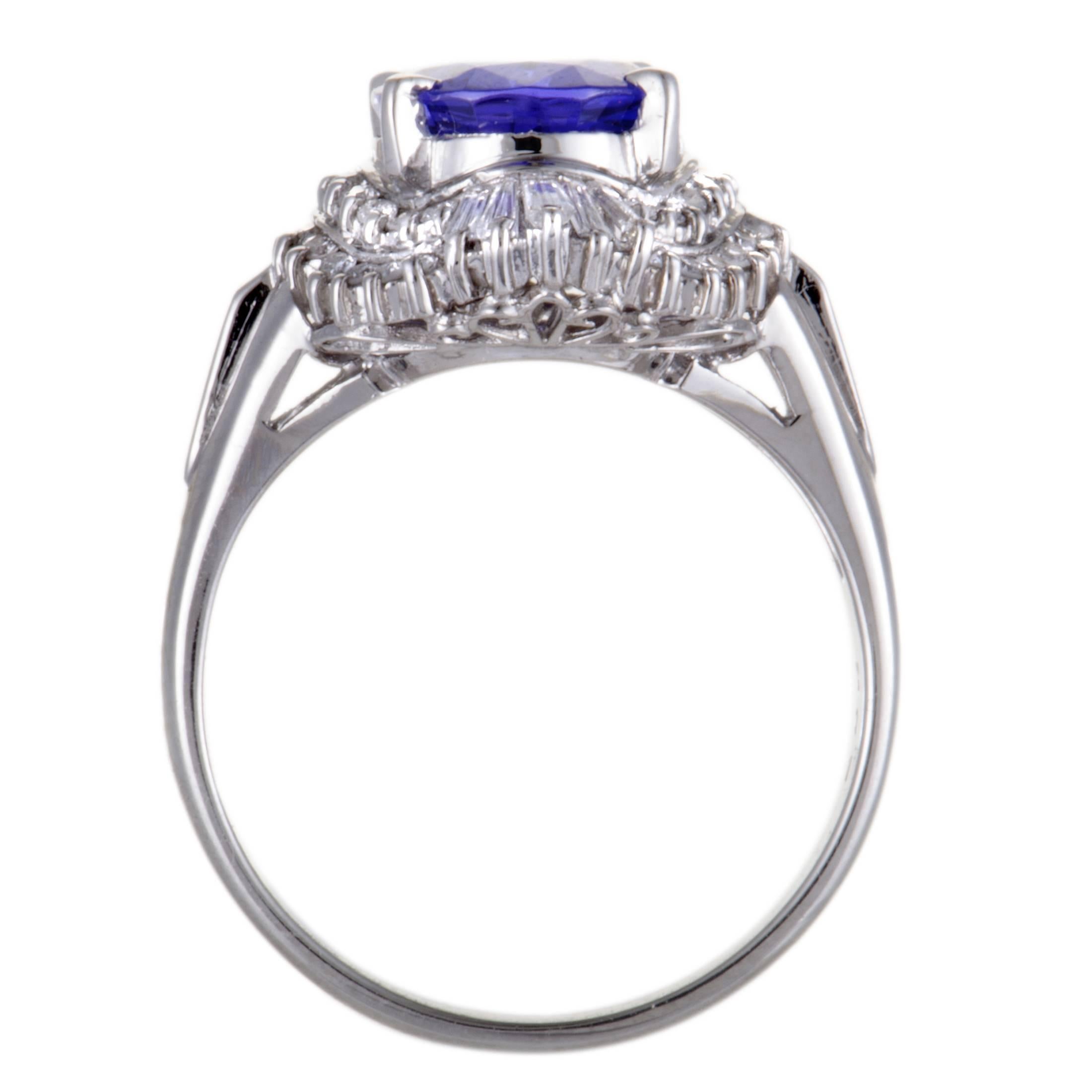 Sensationally crafted in shimmering platinum, this gorgeous ring is a perfect example of sheer beauty! The stunning ring is adorned in 0.45ct of dazzling diamonds surrounding a captivating blue tanzanite of 2.82ct that immensely elevates the value