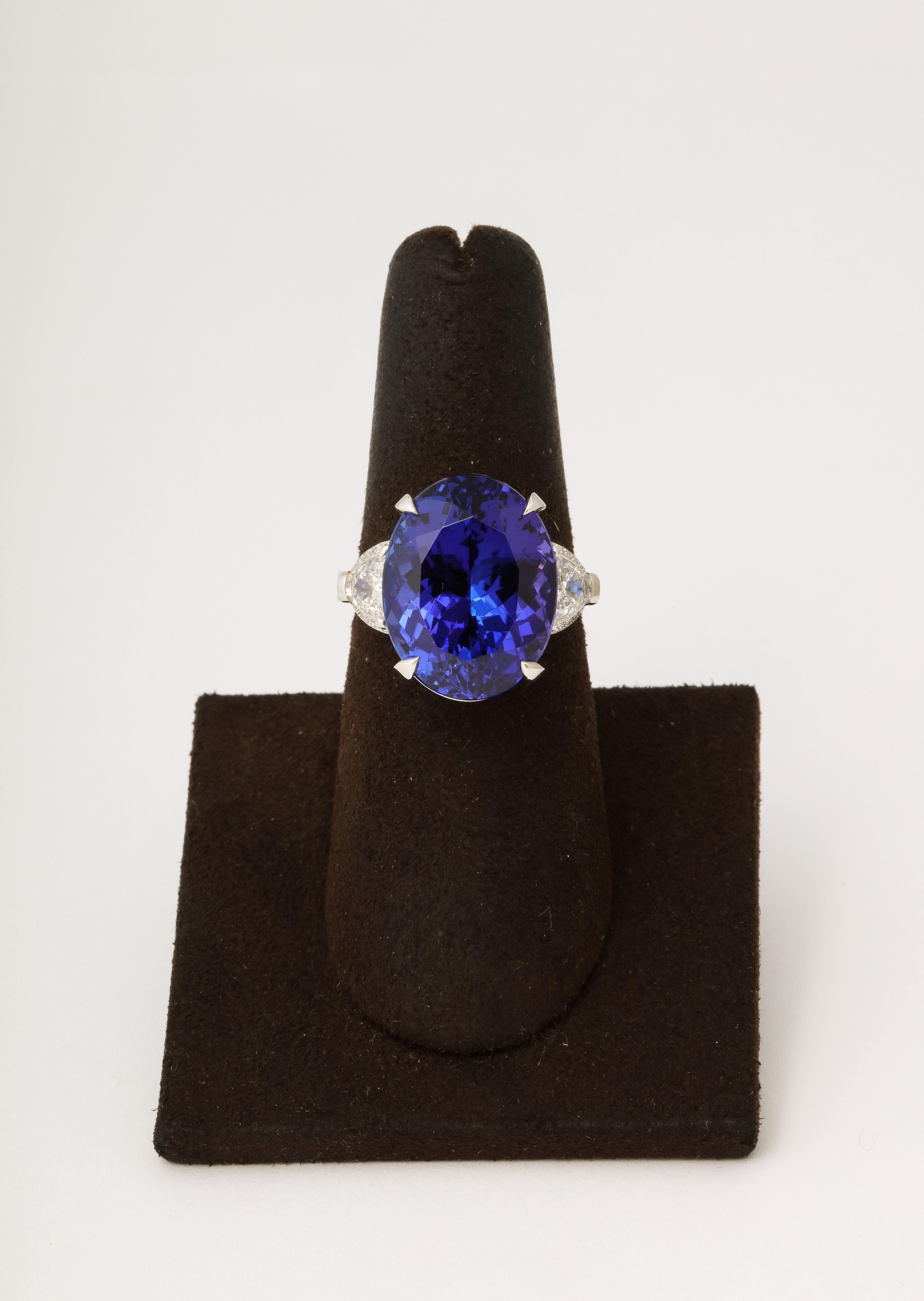 
A SUBLIME tanzanite! 

14.89 carat GIA certified Oval Tanzanite 

1.10 carats of side diamonds. 

Custom made in platinum. 

Currently a size 6.5 this ring can easily be resized. 


