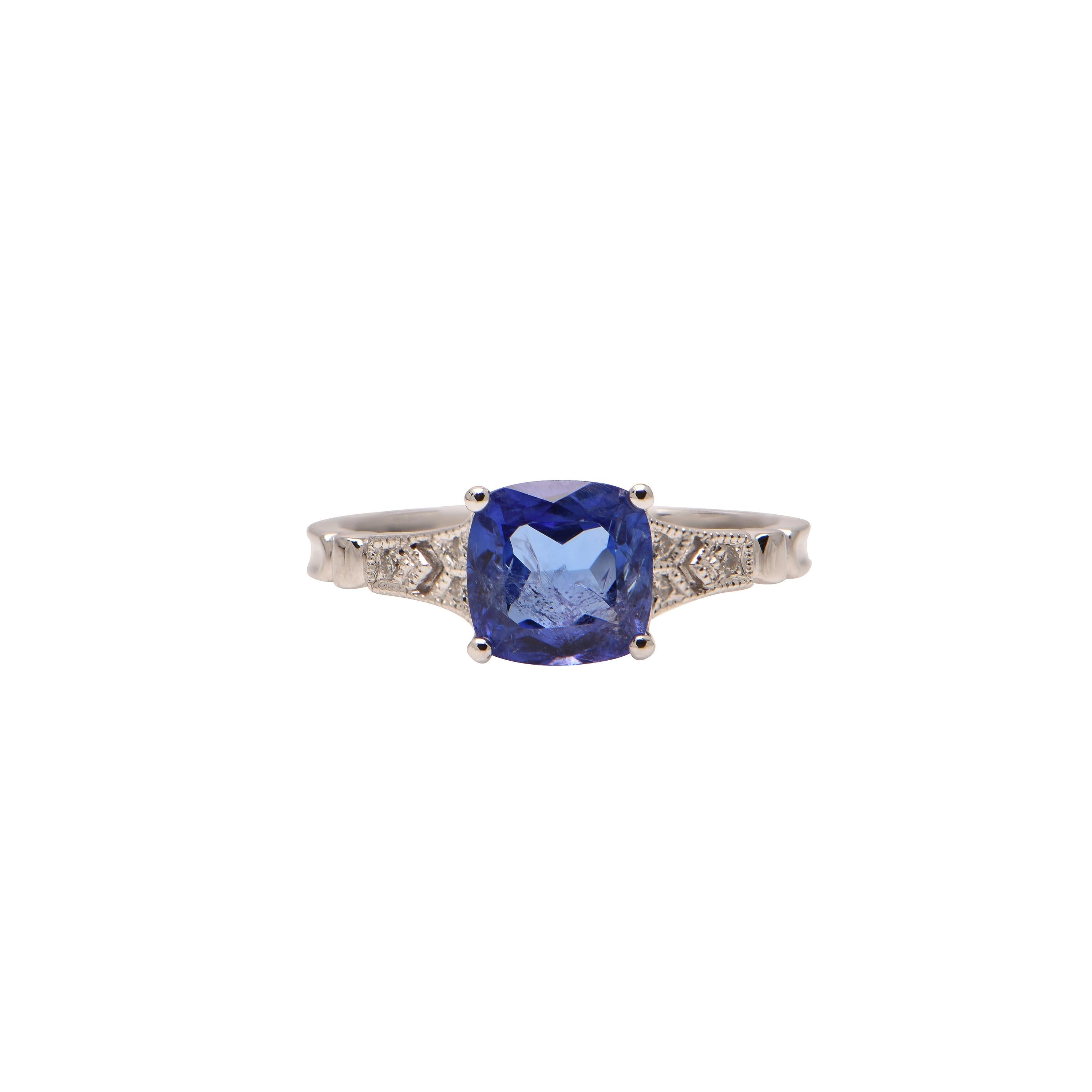 An 18ct White Gold ring showcasing a Tanzanite (1.63ct), and 6 Diamonds totalling 0.04ct.