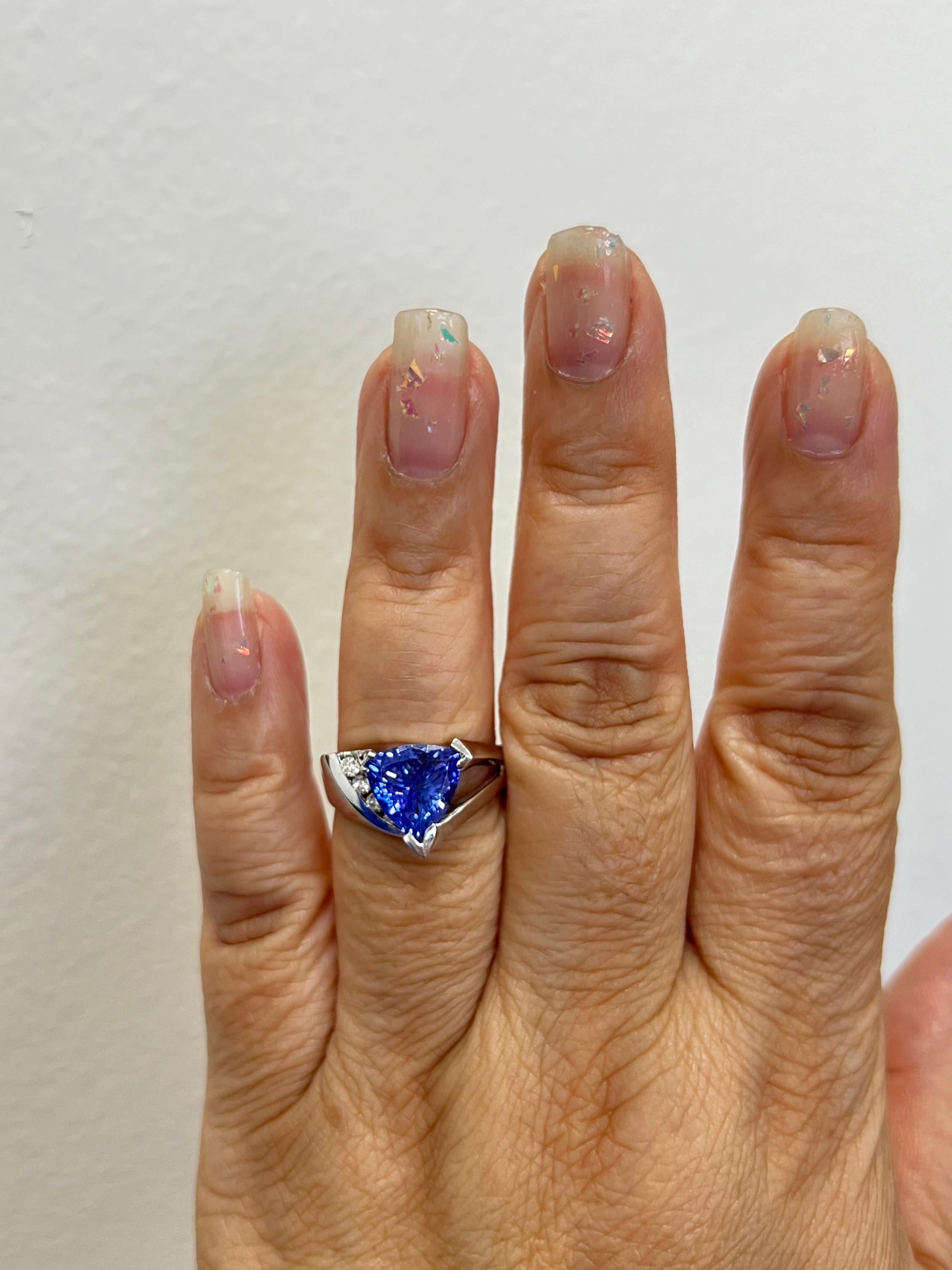 Beautiful 4.00 ct. tanzanite trillion with 0.15 ct. good quality white diamond rounds.  Handmade in 14k white gold.  Ring size 9.5.