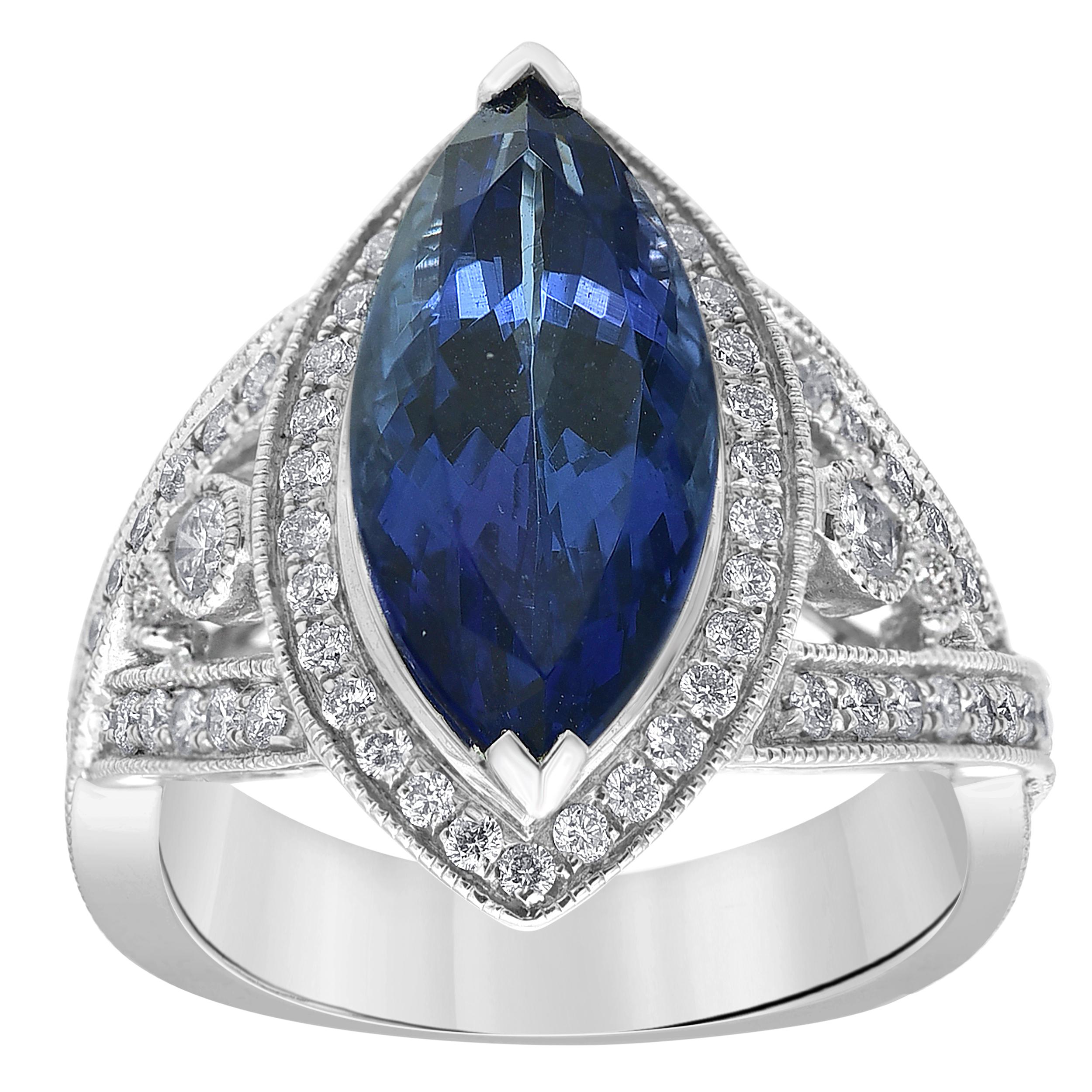 Elevate his evening attire with this appealing fashion ring. Beautiful pear tanzanite ring set, made with 14K white gold.