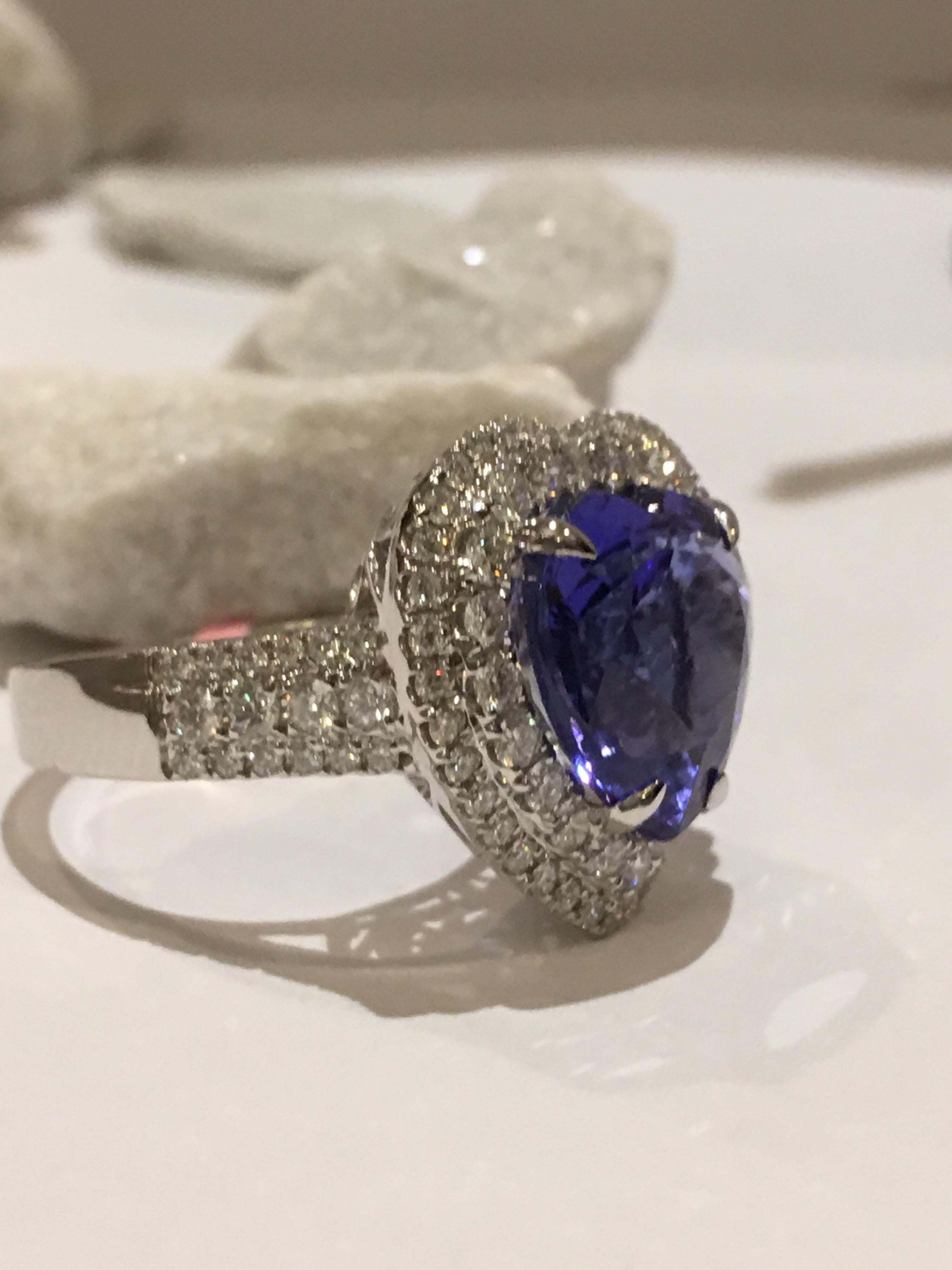 Natural Heart shape 6.73 Carat Tanzanite set in 14K White Gold  with 1.13 Carat White Diamond.
The ring with Double Halo setting is one of a kind hand crafted Ring.
The size of the Ring is 7 and this Ring can be resized.
