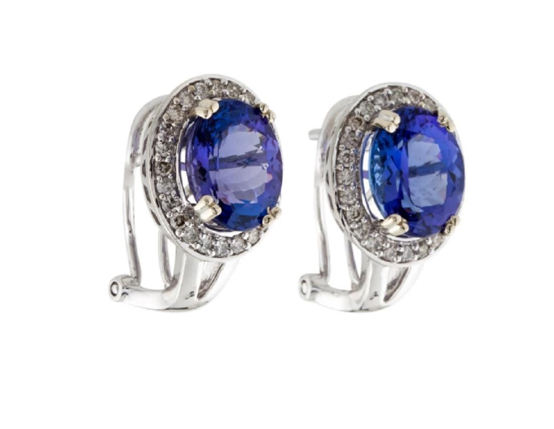This is a breath-taking tanzanite and diamond stud earrings stamped in 14K white gold. The striking tanzanite has a rich color and is encompassed by delicate white diamonds.

*****
Details:
►Metal: White Gold
►Gold Purity 14K
► Tanzanite Weight: