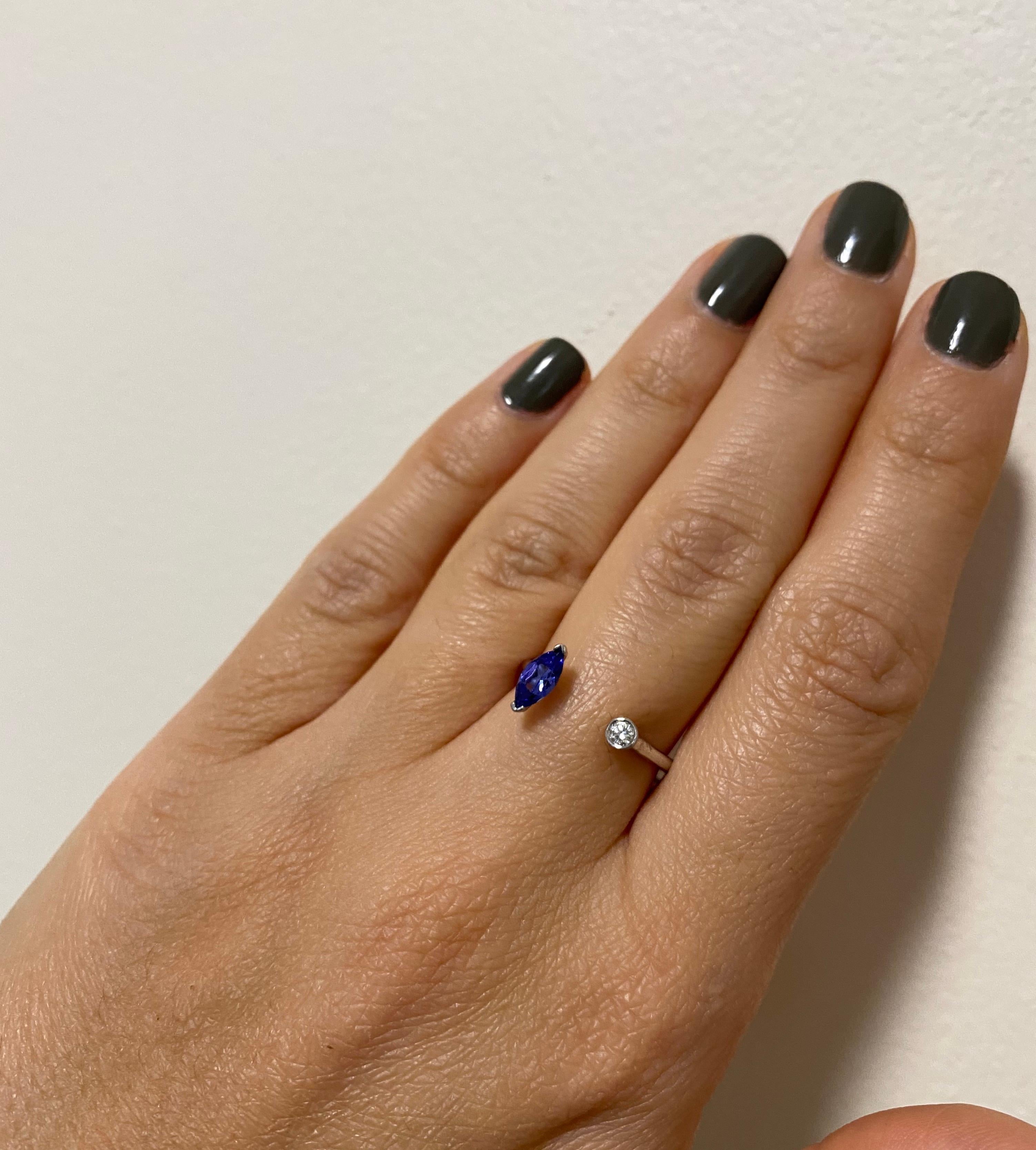 Material: 14K White Gold
Stone Details: 1 Marquise shaped Tanzanite at 0.31 Carats - Measuring 6.6 x 3.2mm
Diamond Details: 1 Brilliant Round White Diamond at 0.05 Carats
Alberto offers complimentary sizing on all rings.

Fine one-of-a-kind