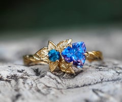 Tanzanite and diamonds 14k gold ring. Flower design ring with tanzanite.