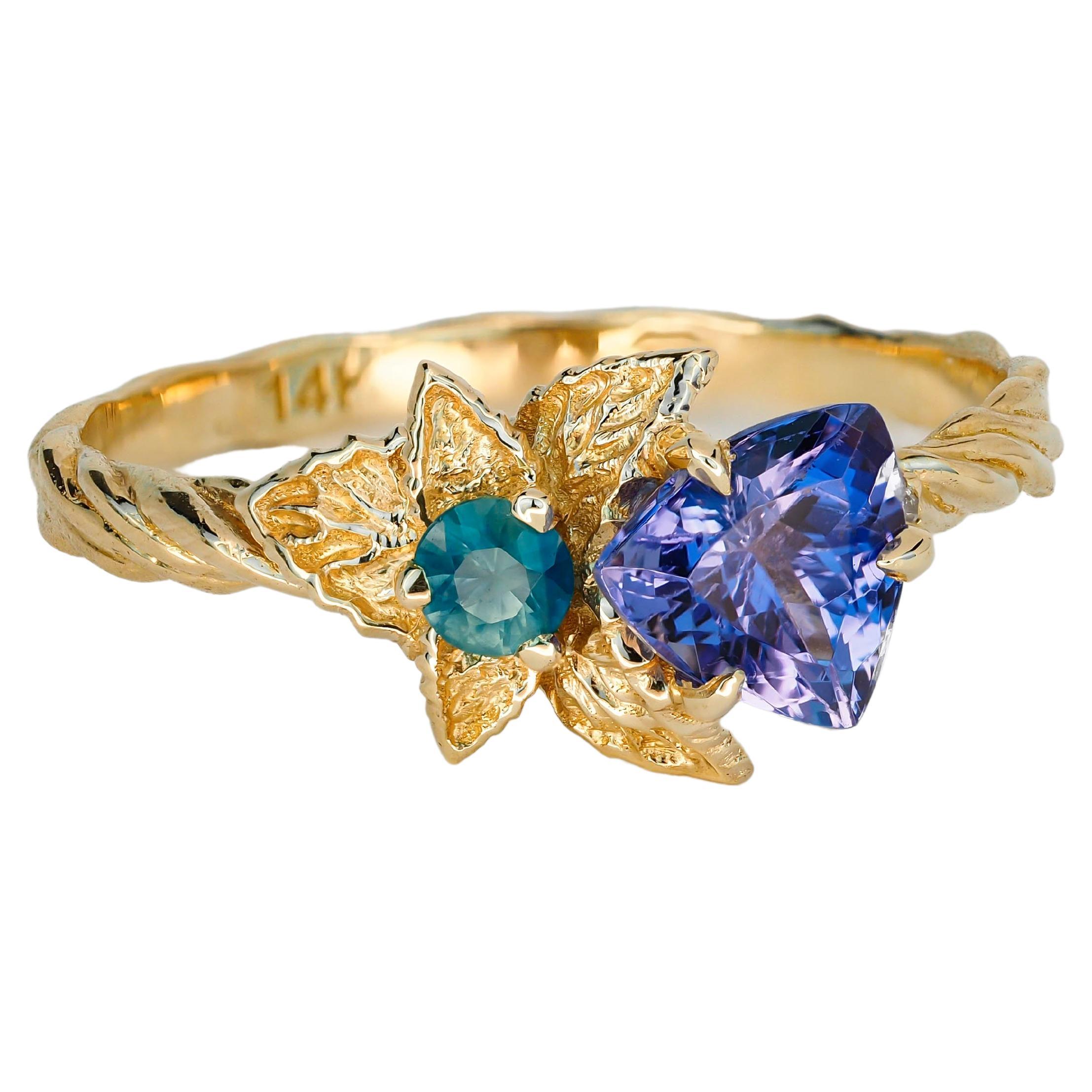 Bague en or 14k avec tanzanite et diamants. Bague à motif de fleur avec tanzanite.