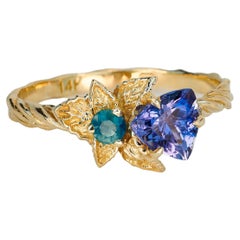 Anillo de tanzanita y diamantes de oro de 14k. Anillo de diseño floral con tanzanita.
