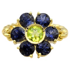 Tansanit und Peridot Blumenring mit Scharnier und Seilband aus 18 Karat Gelbgold