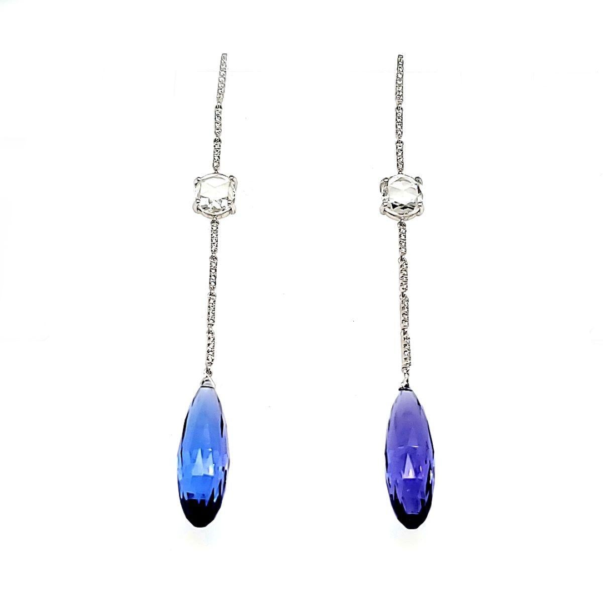 The possibilities are endless with these versatile and captivating drop earrings.

Adorned with 2 Tanzanite Faceted Drops totaling 23.70 carats, each earring features a mesmerizing Tanzanite hanging gracefully at the bottom.


Nestled in the center