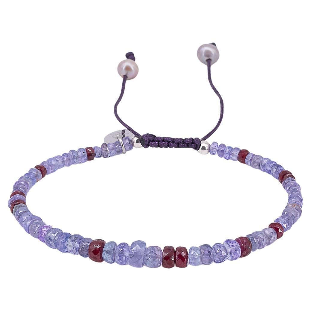 Tanzanite and ruby bracelet with purple drawstring closure