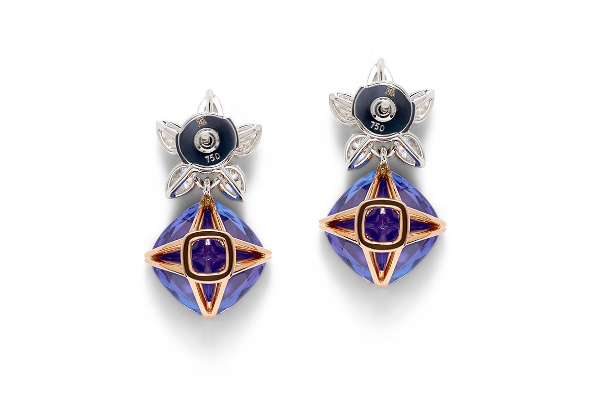 18 Carat Gold Tanzanite and White Diamond Earrings

Blossom Collection Tanzanite and Diamond earrings. The Blossom Collection gemstones are a uniquely designed cushion cut, featuring a high table to emulate the antique Georgian style period, with a