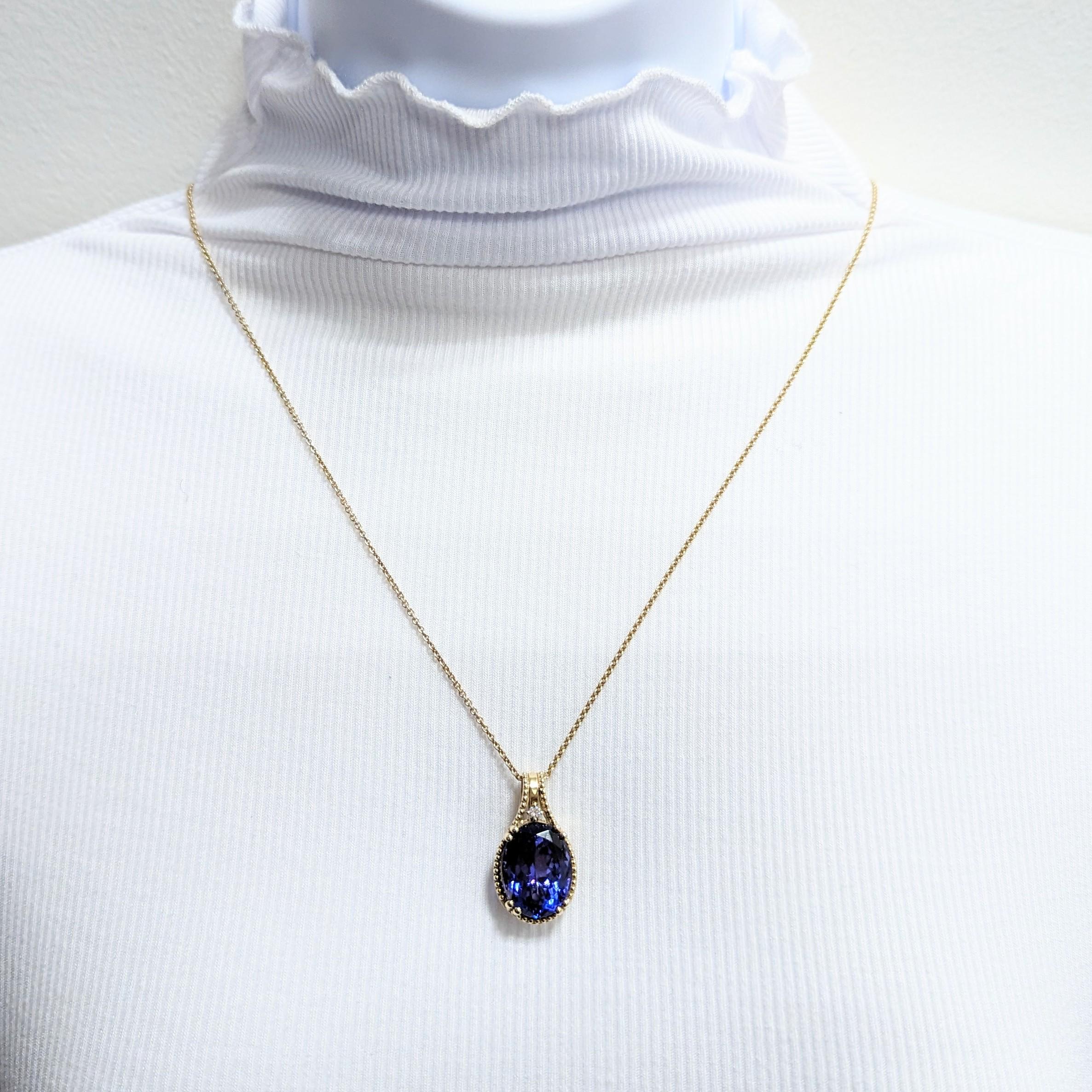 Beautiful 15.45 ct. tanzanite oval with 0.05 ct. white diamond rounds.  Handmade in 14k yellow gold.  Length is 18