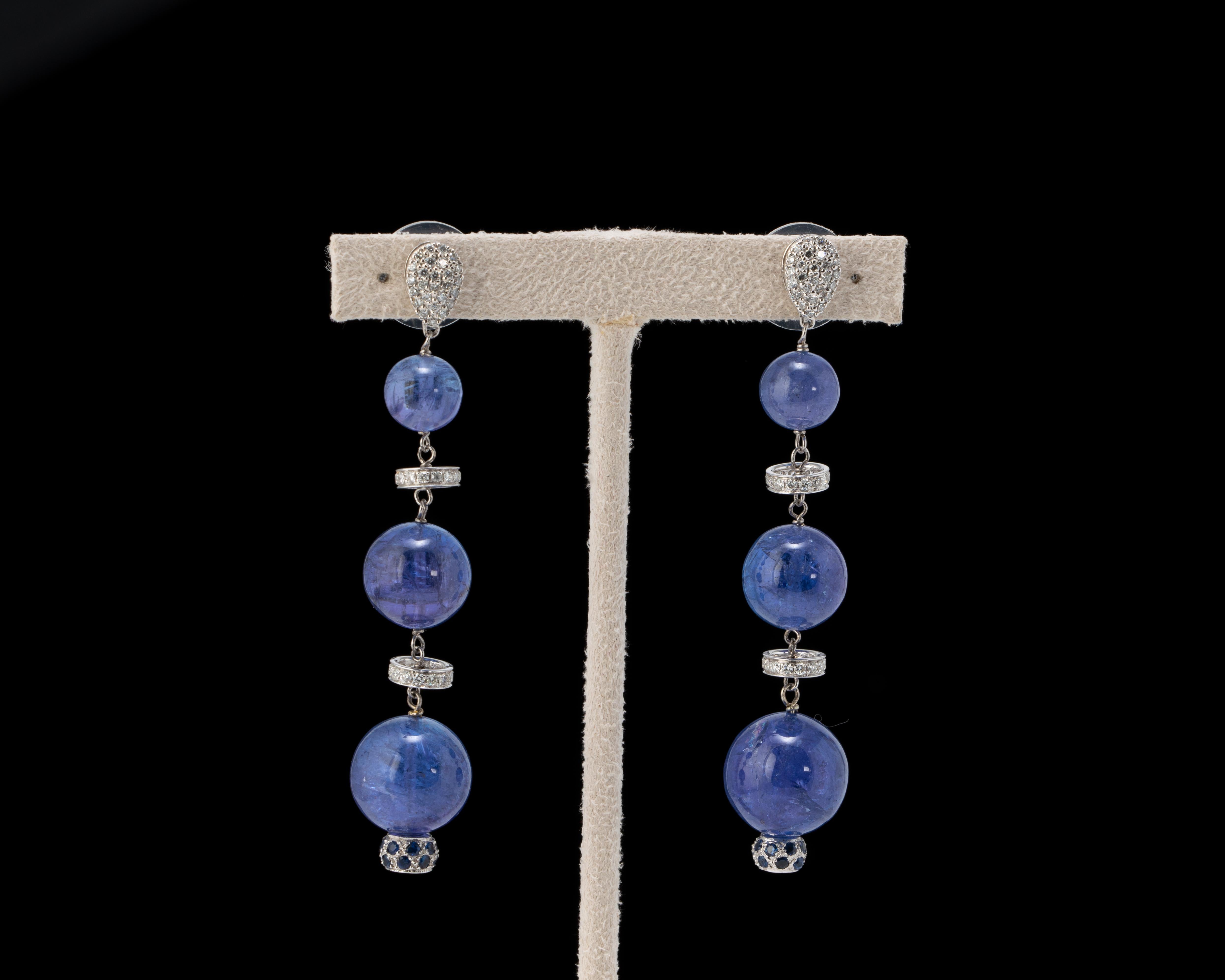 A fabulous pair of 74 carats Tanzanite, Diamond and 18K Gold earrings with great movement and a pop of color. 
Please feel free to message us if you have any queries. 
Free shipping provided. Returns accepted. 