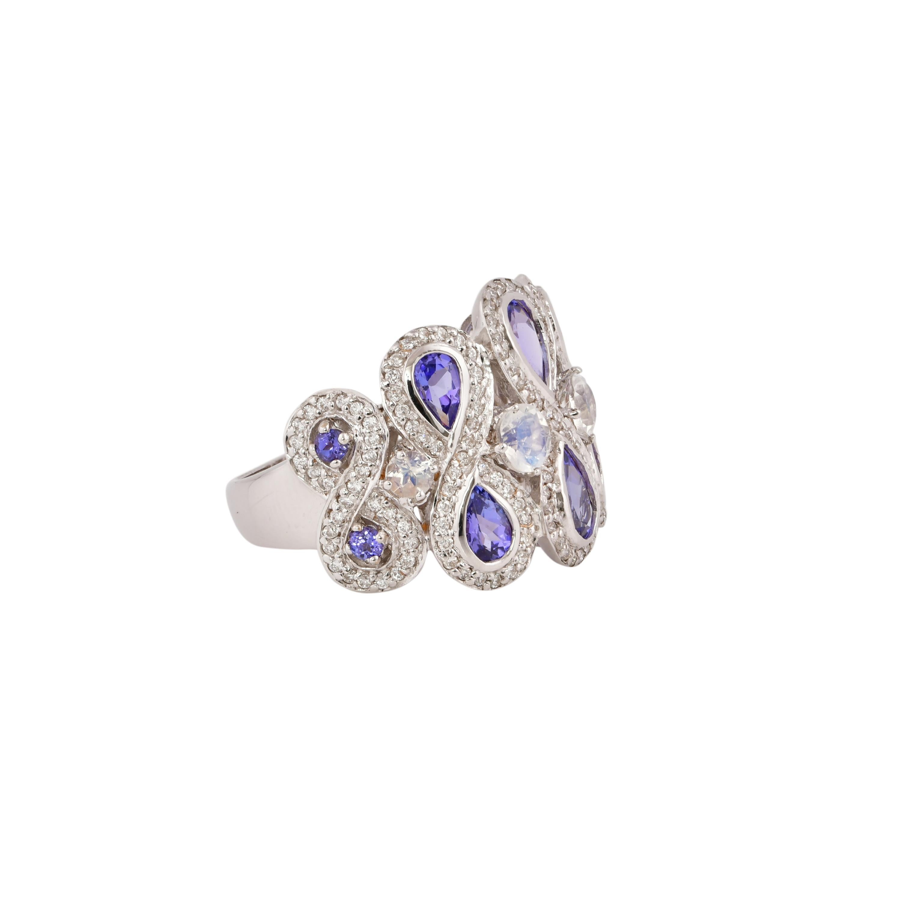 Sunita Nahata presents a collection of fancy cocktail rings with gorgeous gemstones. This ring uniquely pairs tanzanites with blue moonstones. The banded design makes the a striking yet subtle cocktail ring that will definitely have heads turning.