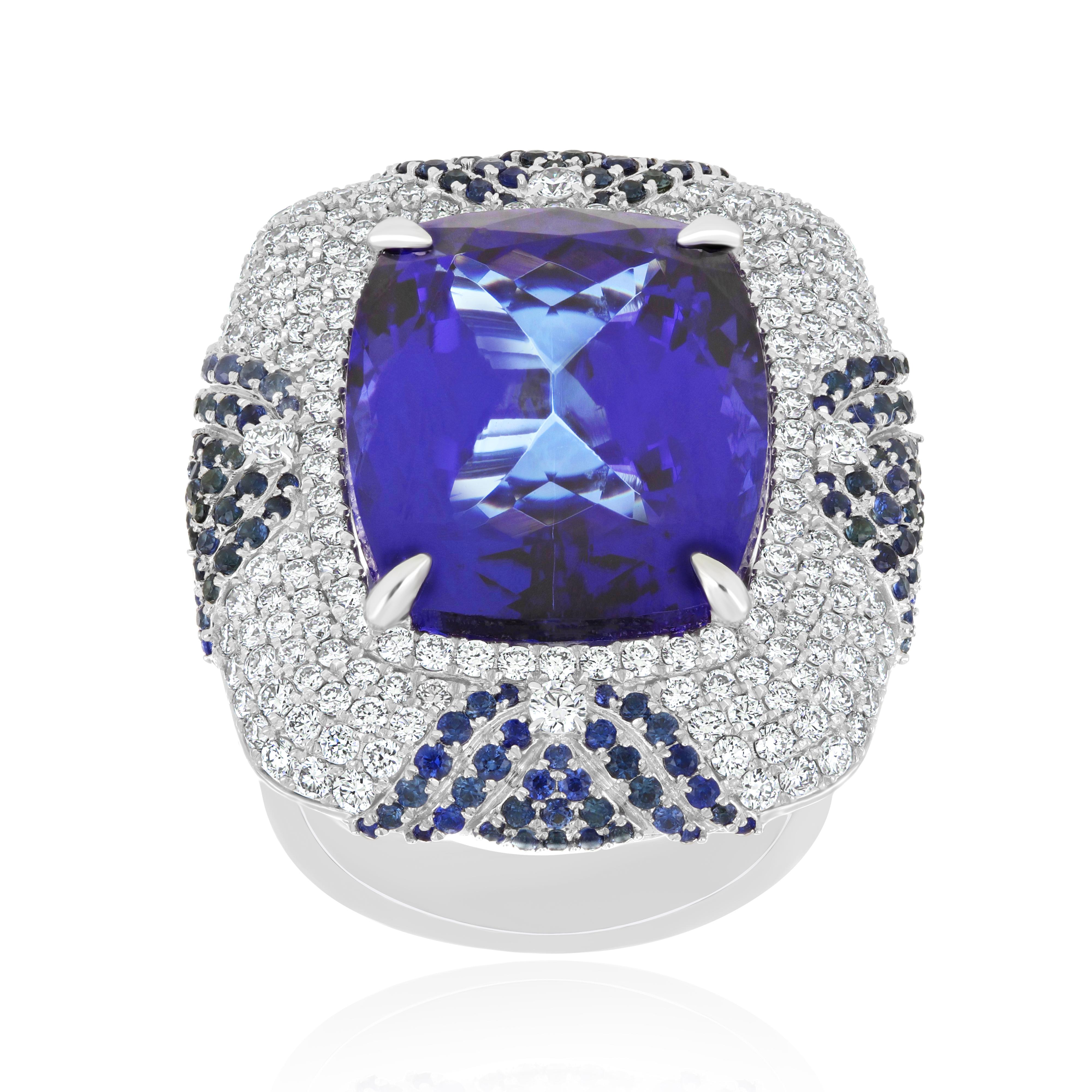 Elegant and Exquisitely detailed White Gold Ring, with a rare 24.30Cts (approx.) Cushion Round Corner
Tanzanite set in the center beautifully accented with Micro pave set Diamonds, weighing approx. 2.50 CT's (approx.). total carat weight and Blue