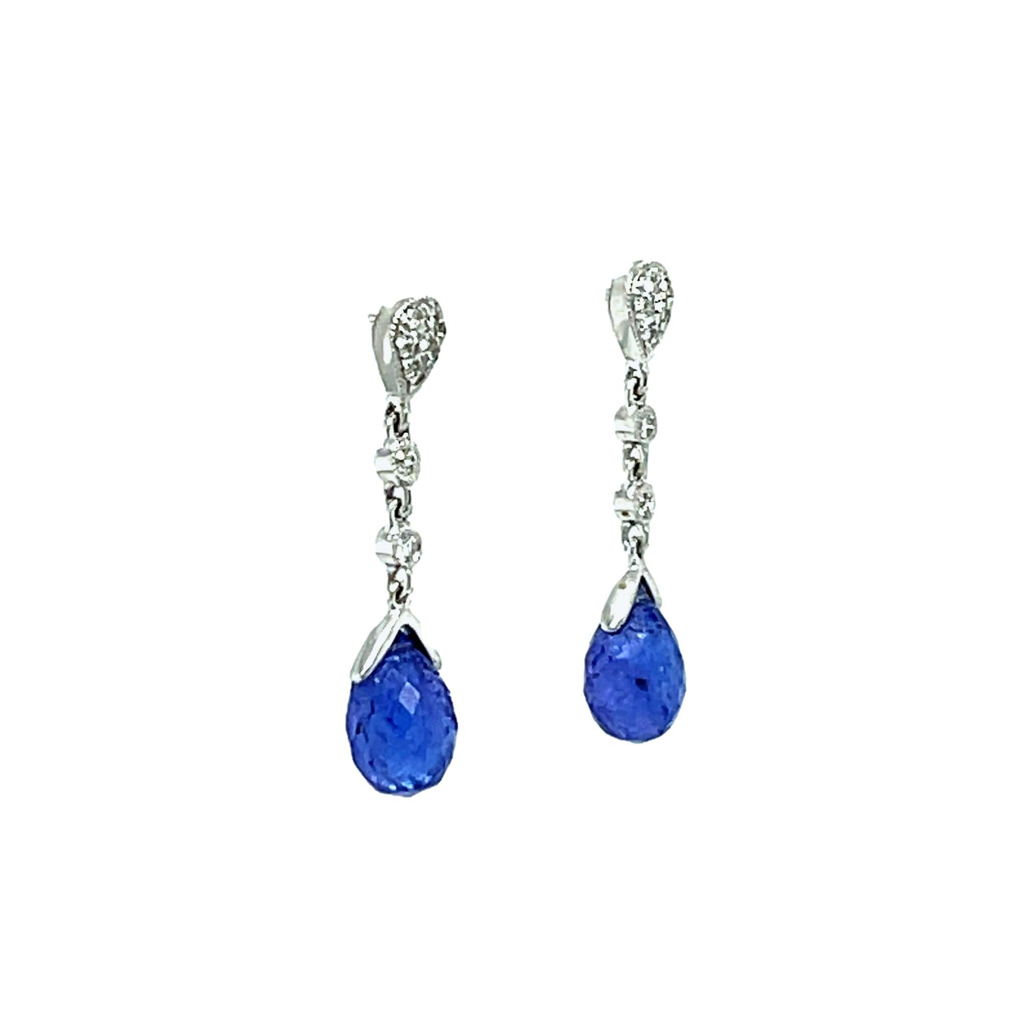 These gorgeous deep blue Briolette Tanzanite dangling earrings are beautiful to wear to any event. They are set in 18 karat white gold and have brilliant cut round diamonds. They have double push back closure for extra security. These earrings come