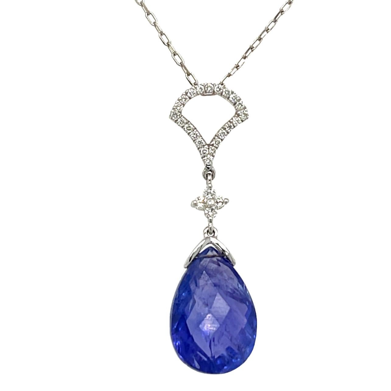 These gorgeous deep blue Briolette Tanzanite dangling pendant is beautiful to wear to any event. The Tanzanite has natural inclusions and is tension set in 18 karat white gold and has brilliant cut round diamonds. The pendant comes with a silver