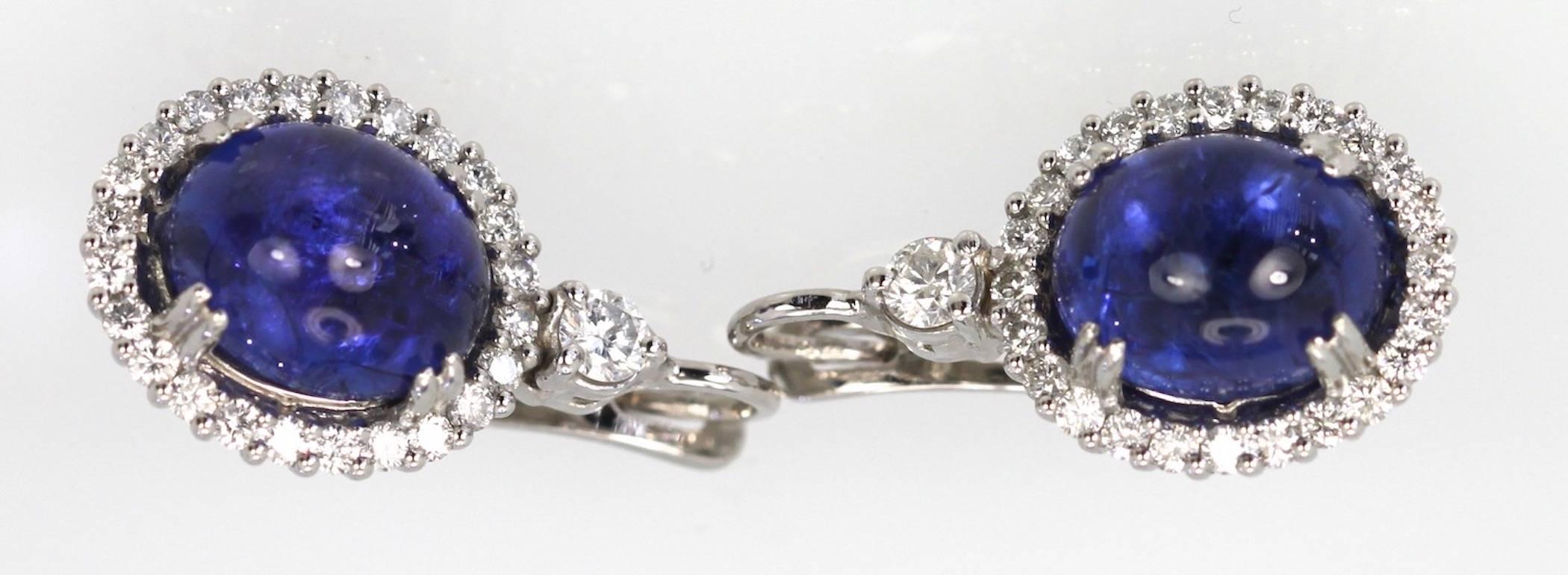 These Tanzanite Cabochon Diamond Earrings I love.  They match the Tanzanite Pendant and Ring listed and they are a gorgeous shade of Blue with nice matrix of violet.  They reflect light and have amazing sparkle. The color is fantastic and the