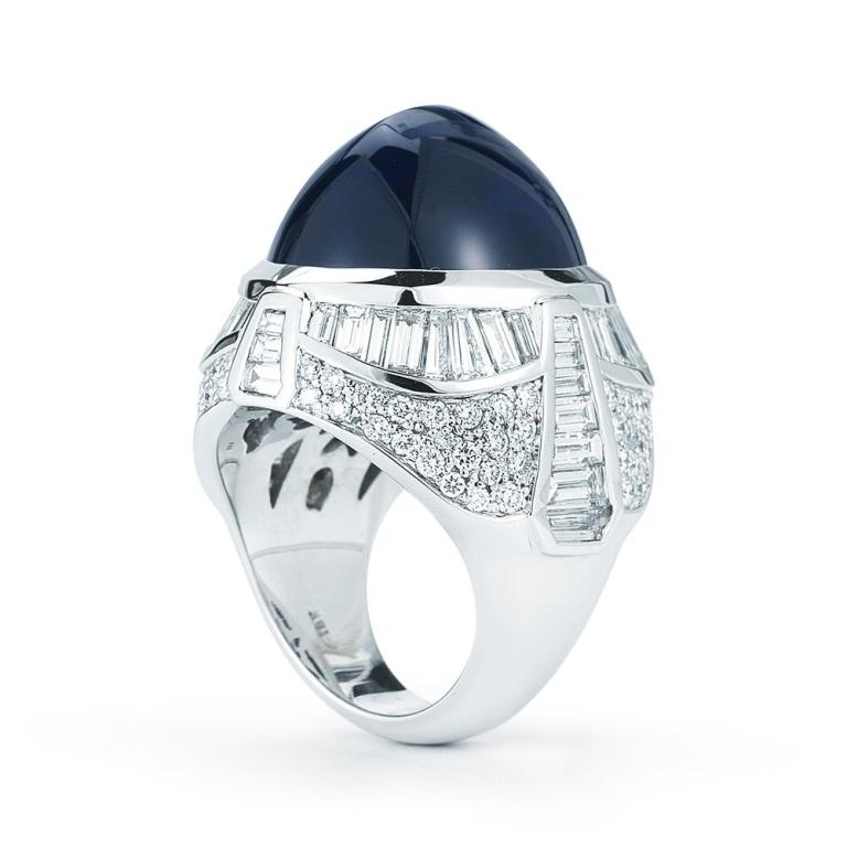 TANZANITE CABOCHON RING This luscious Tanzanite Cabochon ring features rows of baguettes right above collections of bright white diamonds in a striking arrangement to make this ring a one of a kind pieces Item: # 01742 Metal: 18k W Lab: Gia Color