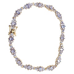 Bracciale a grappolo con tanzanite in oro giallo 14k