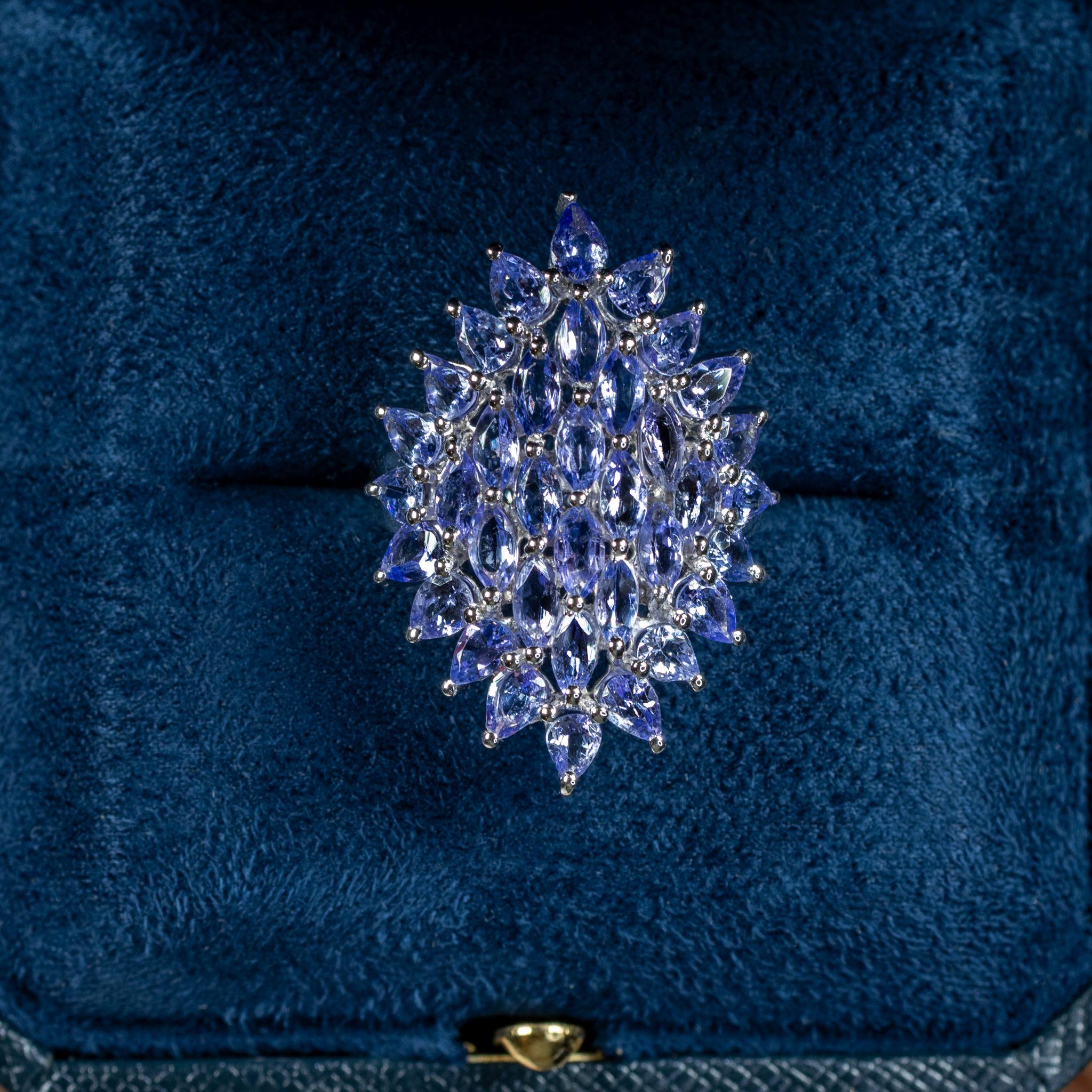 It comes with the Gemological Appraisal by GIA GG/AJP
All Gemstones are Natural
36 Tanzanites = 5.05 Carats
Cut: Marquise, Pear
Metal: Rhodium Plated Sterling Silver
Ring Size: 7* US
*It can be resized complimentary