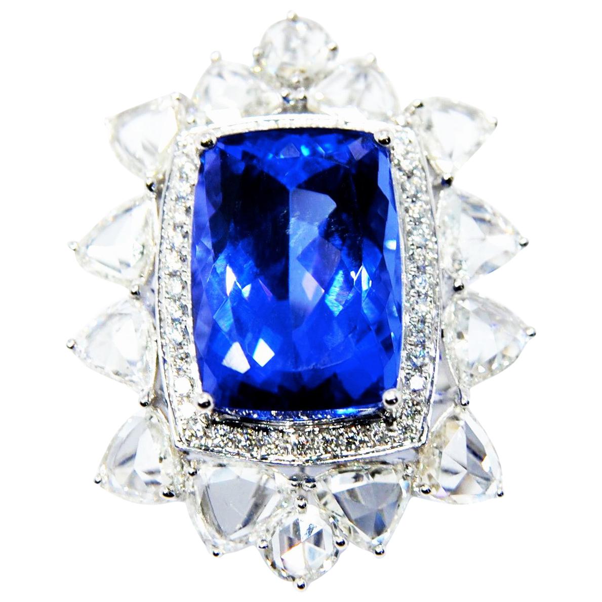 Tanzanite Cocktial Ring in 18 Karat Gold Nested in an Oval Crown of Diamonds