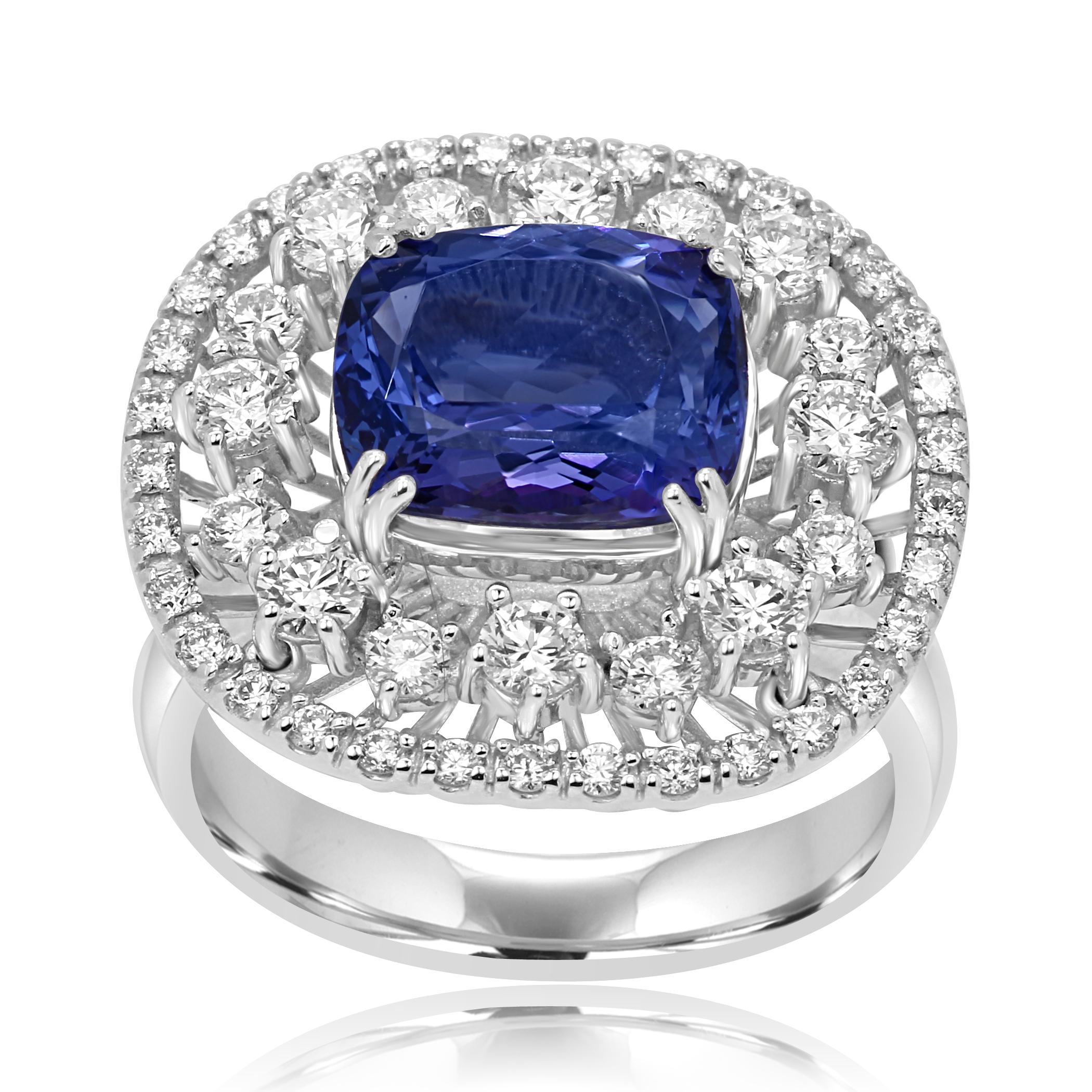 Tanzanite Cushion 3.23 Carat  encircled in a Double Halo of White Round Diamonds 1.02 Carat in a Stunning 14K White Gold Cocktail Fashion Ring with nice wire work on the gallery.

Style available in different price ranges. Prices are based on your