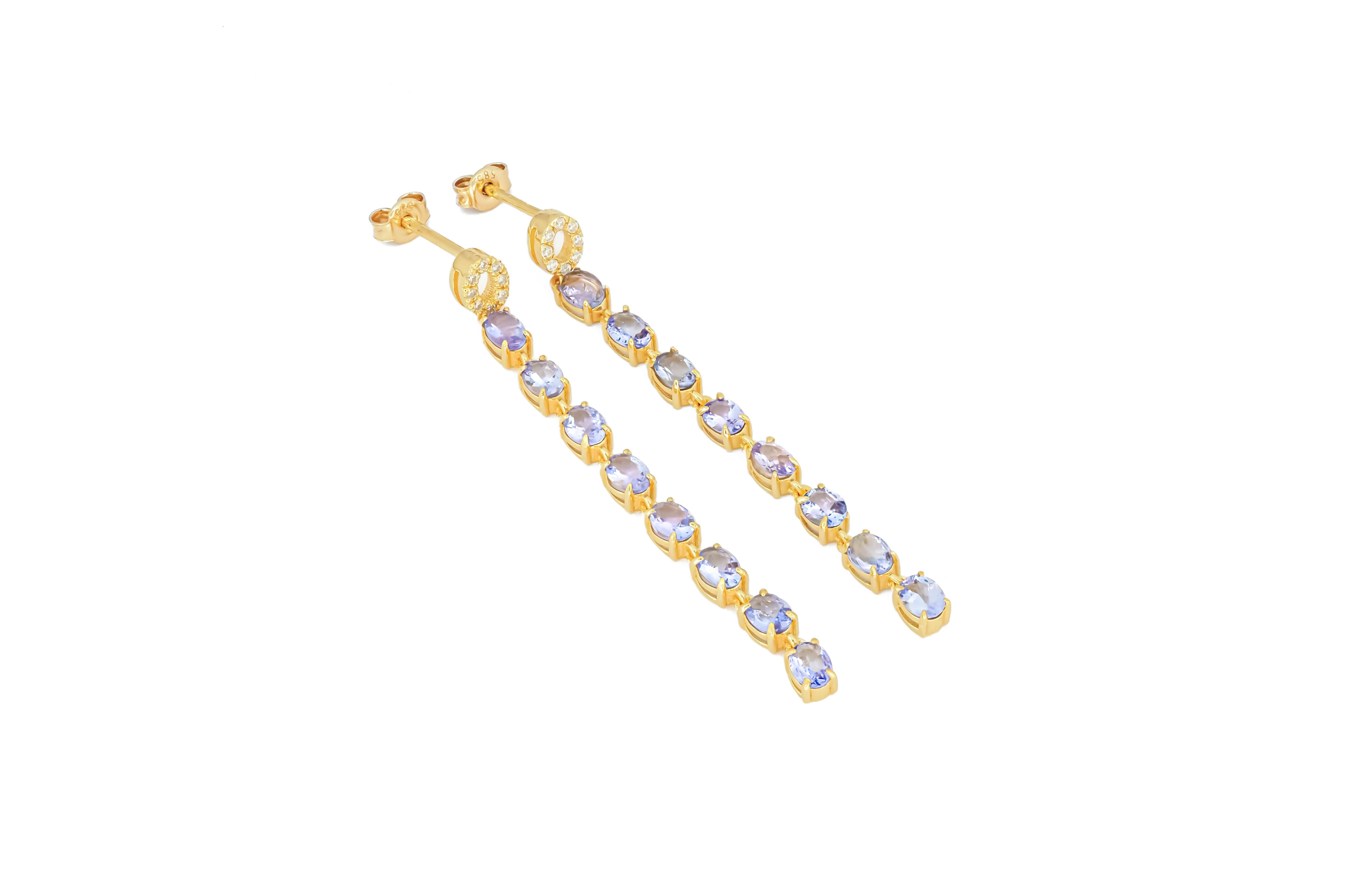 Women's Tanzanite dangle earrings studs in 14k gold.  For Sale