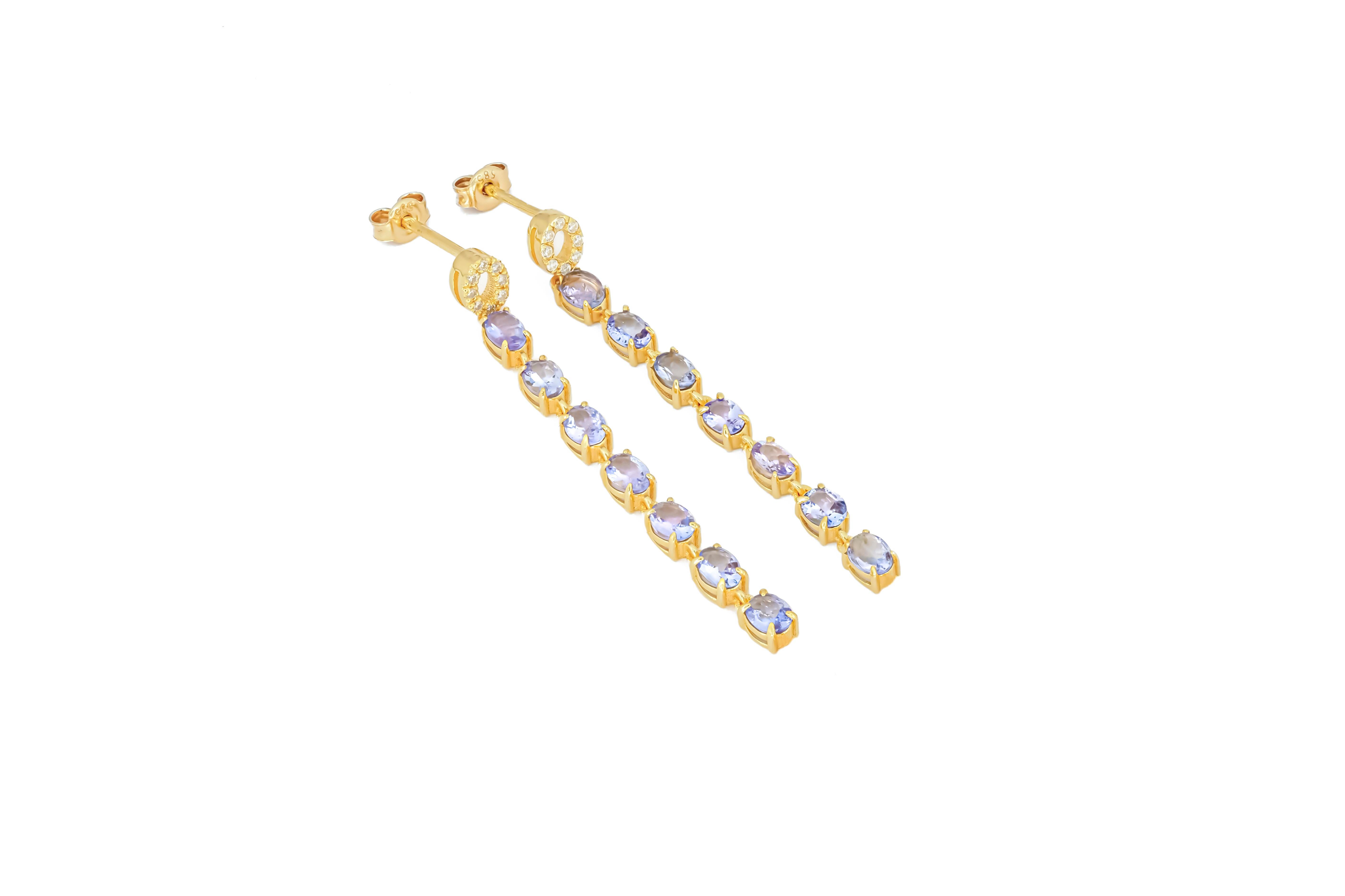 Oval Cut Tanzanite dangle earrings studs in 14k gold. For Sale