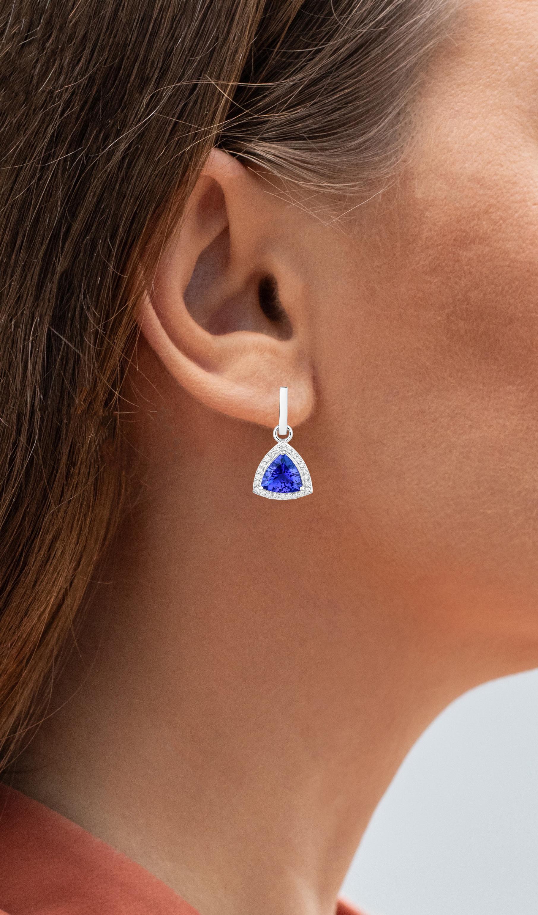 It comes with the appraisal by GIA GG/AJP
All Gemstones are Natural
2 Trillion Tanzanites  = 3.48 Carats
48 Diamonds = 0.38 Carats
Metal: 14K White Gold
Dimensions: 23 x 12 mm
