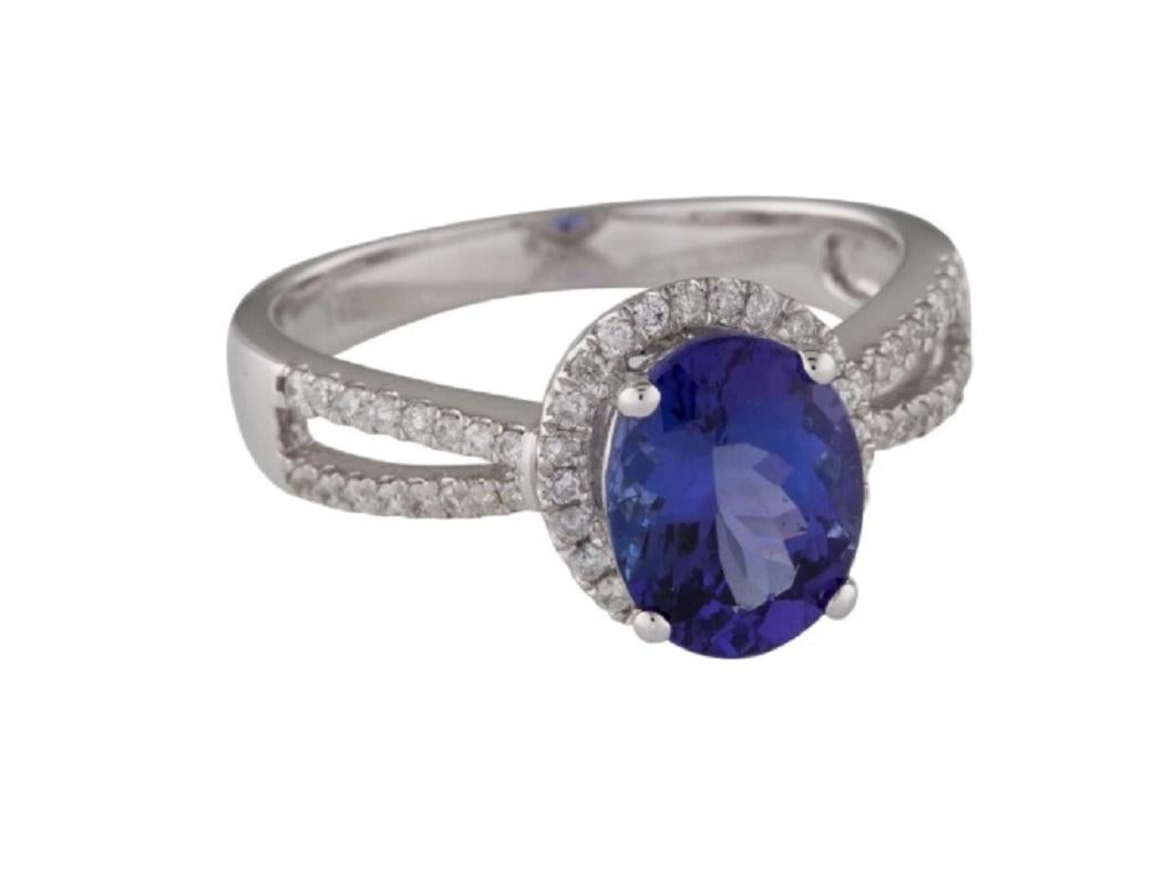 This is a gorgeous tanzanite and diamond ring stamped in solid 14K white gold. The mesmerizing round brilliant diamonds and oval tanzanite have an excellent look and is set on top of a timeless 14K white gold band.

*****
Details:
►Metal: White