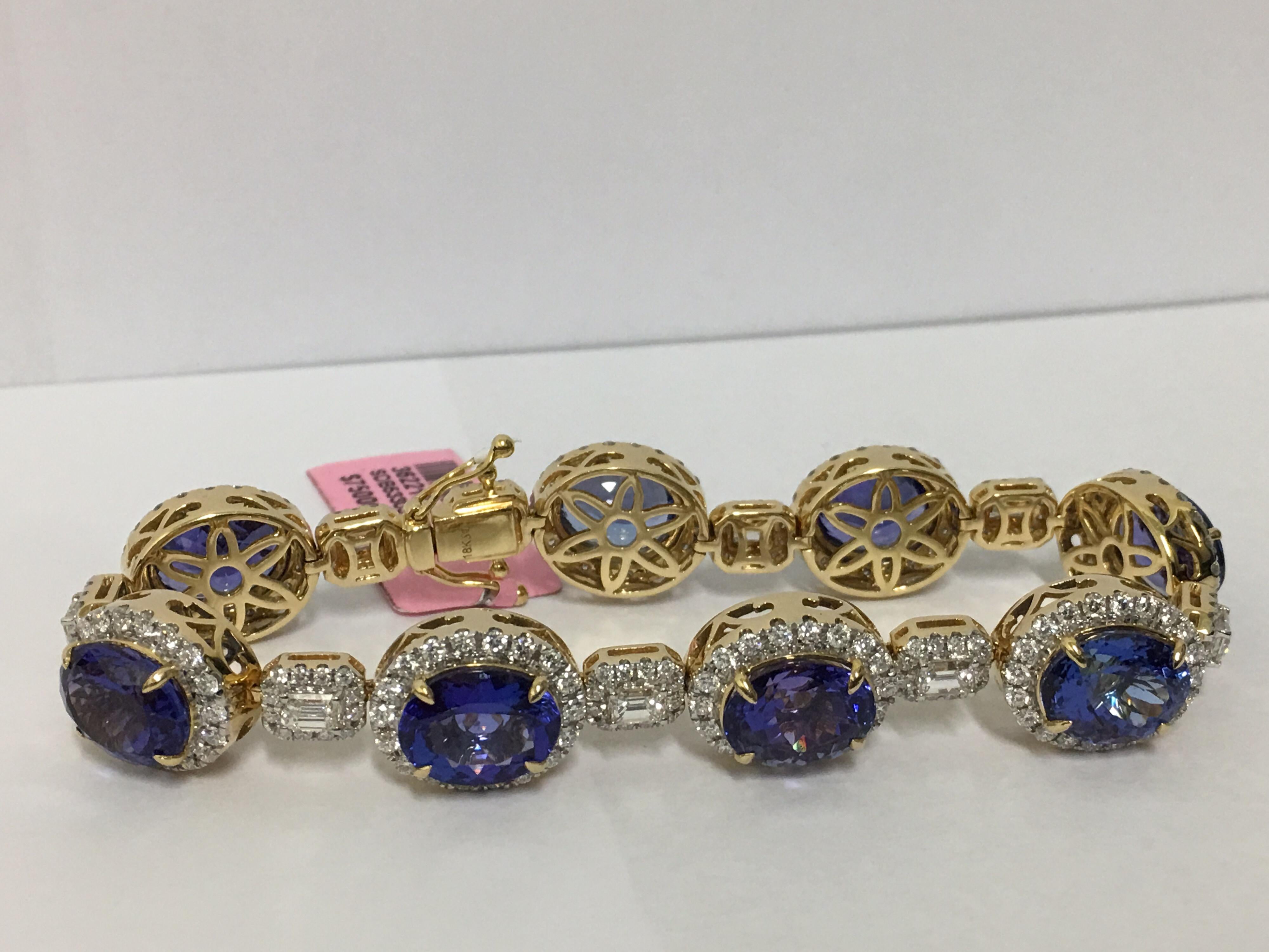 All matched AAA Royal Blue Ink Color Tanzanite is hand made one of a kind Bracelet
The Bracelet is made out of  31.92 Carat Tanzanite and 5.73 Round and Emerald Cut In between.
The Bracelet is made of of 18 Karat yellow Gold.
