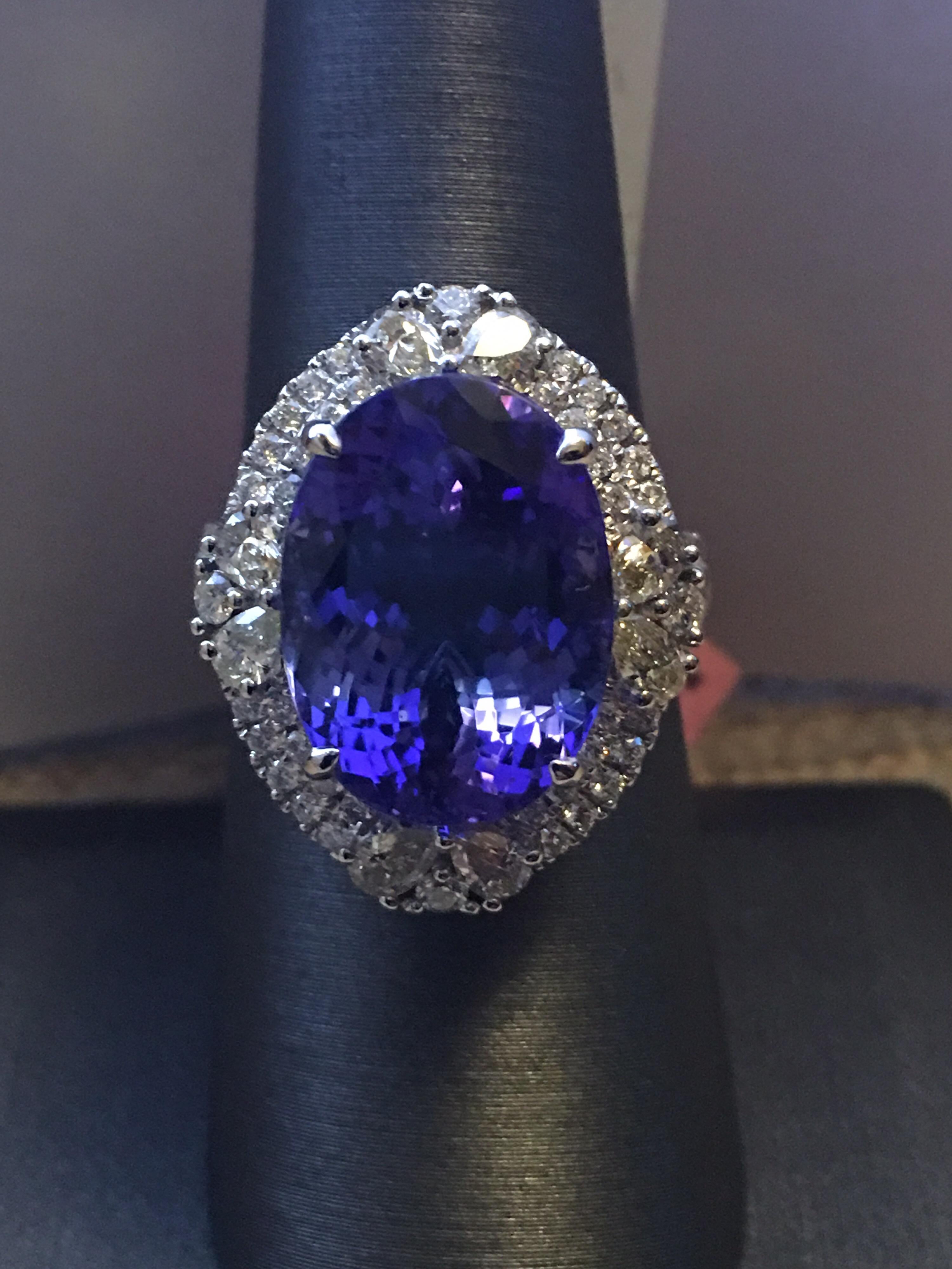 Natural Oval Tanzanite Set In 18 Karat White gold is size 7 Ring. AAA quality Royal Ink Blue Tanzanite is 10.48 Carat and total weight of Diamond is 1.39 Carat.
You can resize the ring if needed.
