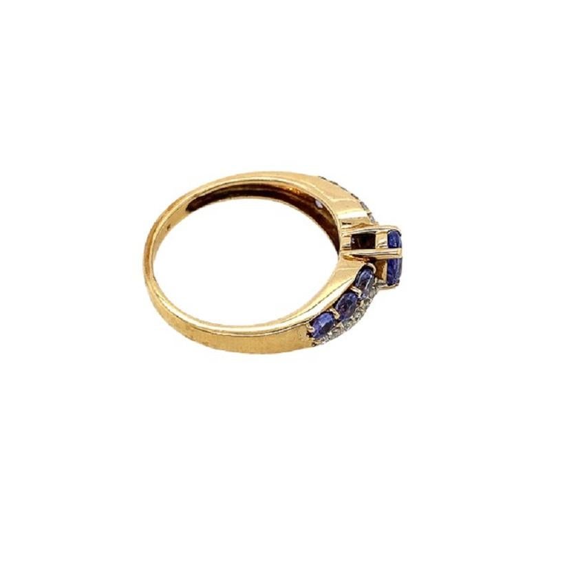 Oval Cut Tanzanite & Diamond Crossover Ring in 9ct Yellow Gold For Sale