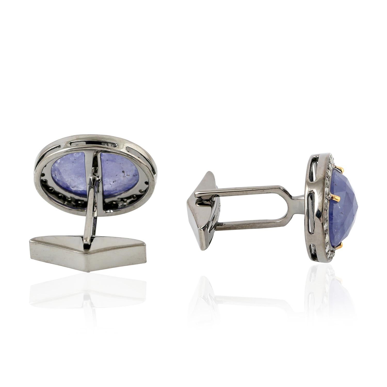 Cast from 18-karat gold and sterling silver, these cuff links are hand set with 10.43 carats tanzanite and .58 carats of diamonds in blackened finish.

FOLLOW  MEGHNA JEWELS storefront to view the latest collection & exclusive pieces.  Meghna Jewels