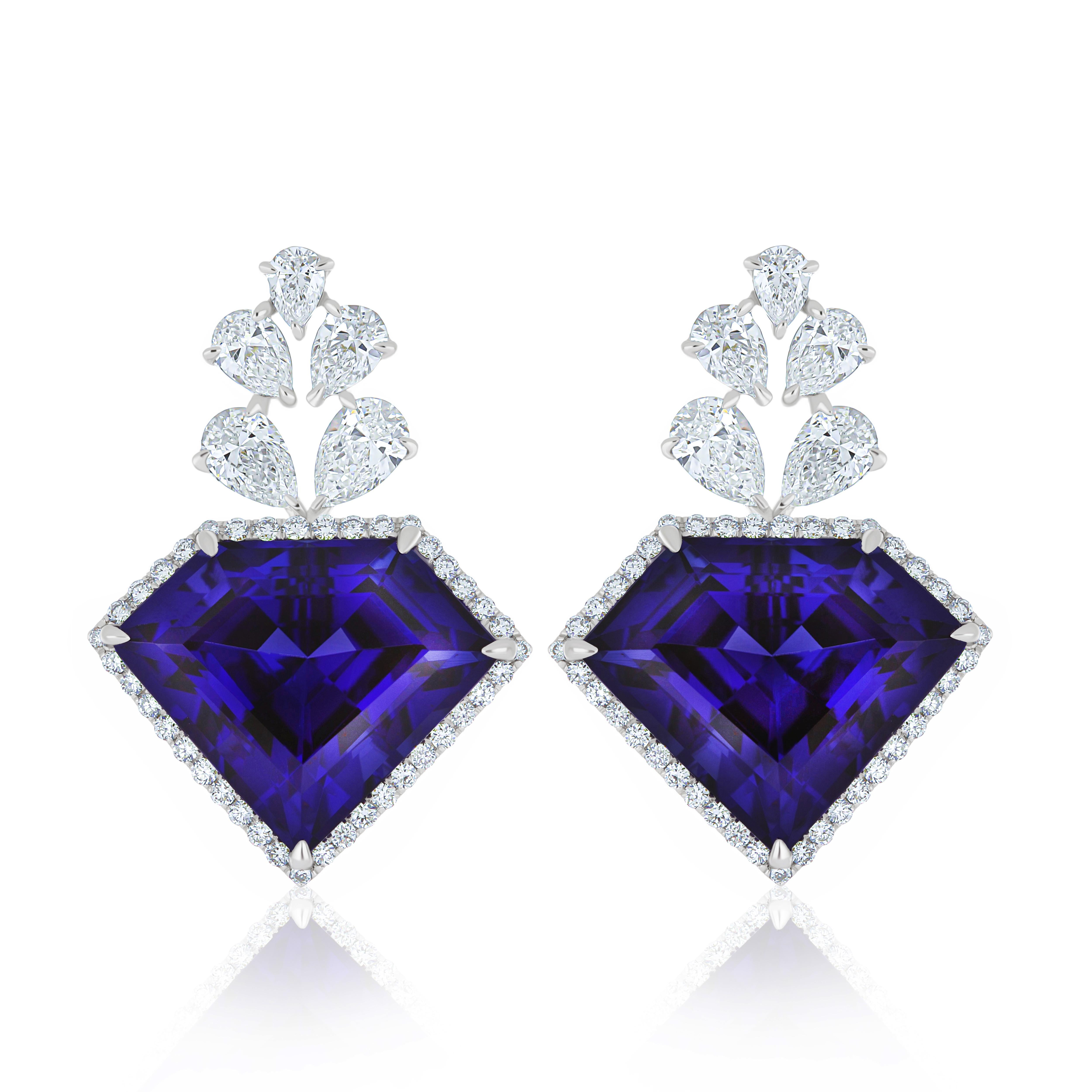 Elegant and Exquisitely Detailed White Gold Earring, with 24.00 ct's (approx.) Tanzanite Exquisitely cut in Unique Diamond Shape accented with micro pave Diamonds, weighing approx. 3.05 ct's (approx.). total carat weight. Beautifully Hand-Crafted