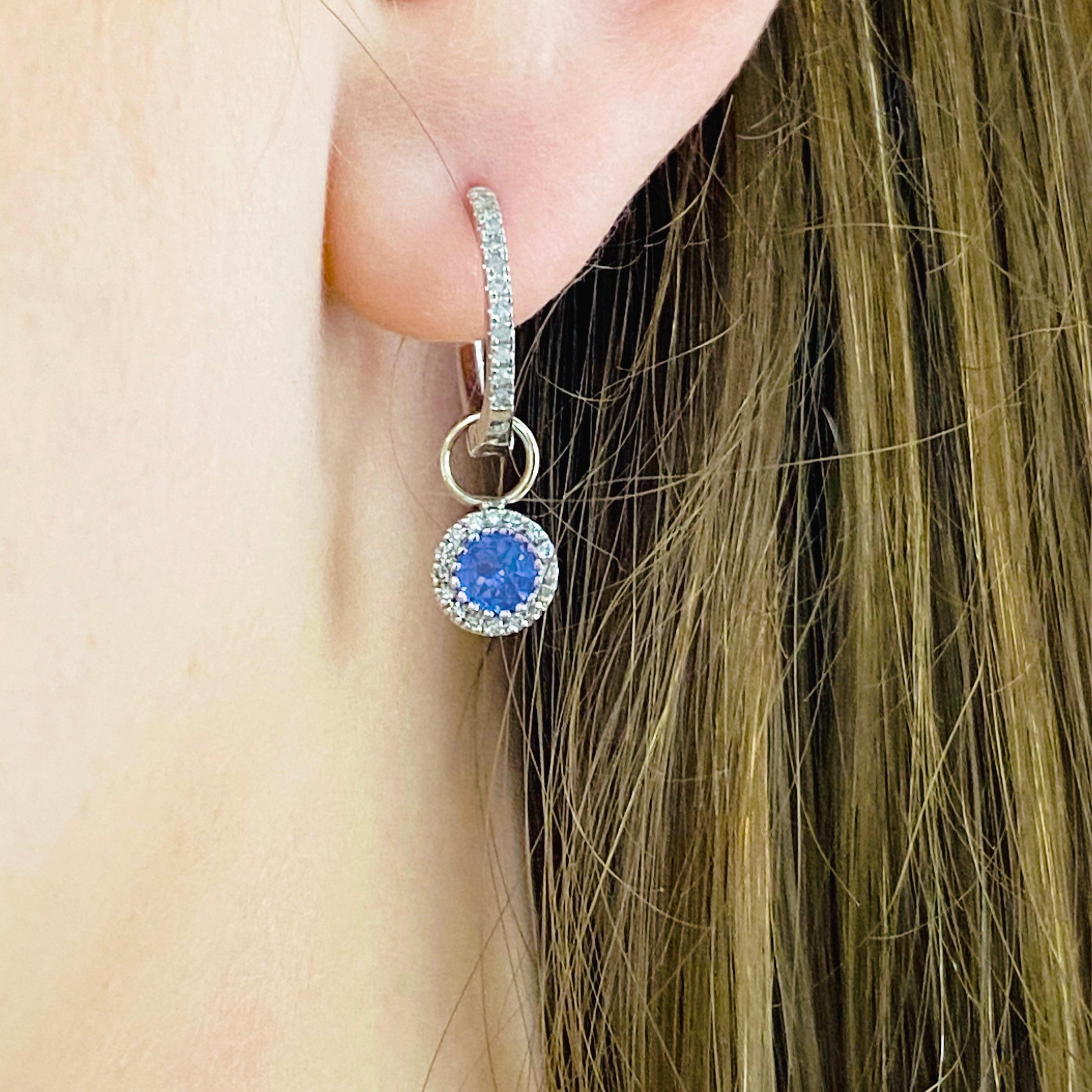 These stunning earring charms are the perfect way to dress up any pair of hoops! With polished 14k white gold surrounding a brilliant round tanzanite and dripping with white diamonds, these charms make the perfect chic and modern accessory for any