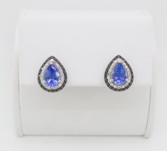 Boucles d'oreilles halo en tanzanite et diamant fabriquées par EFFY