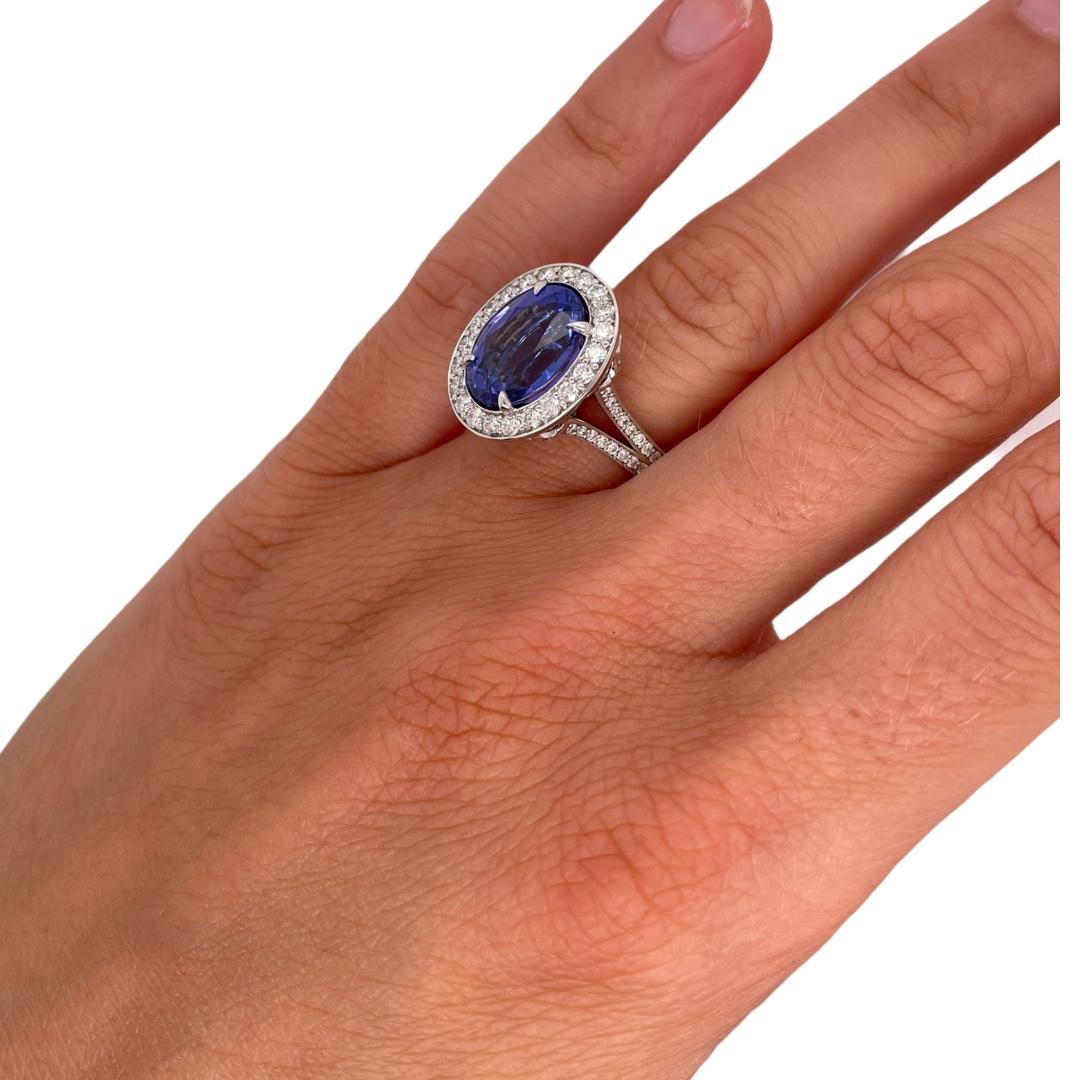 Contemporary Tanzanite & Diamond Halo Ring in 18K White Gold For Sale