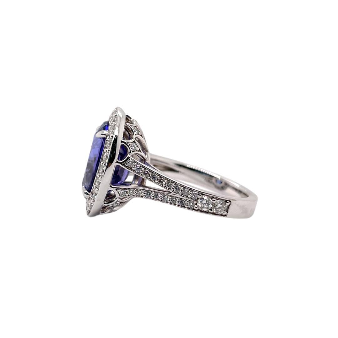 Oval Cut Tanzanite & Diamond Halo Ring in 18K White Gold For Sale